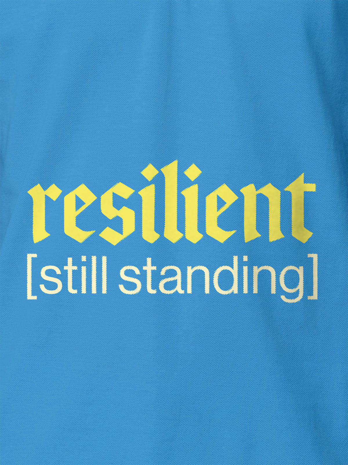 Close up of 'Resilient' design on Women's Blue Polo T-shirt, highlighting intricate details and vibrant print.