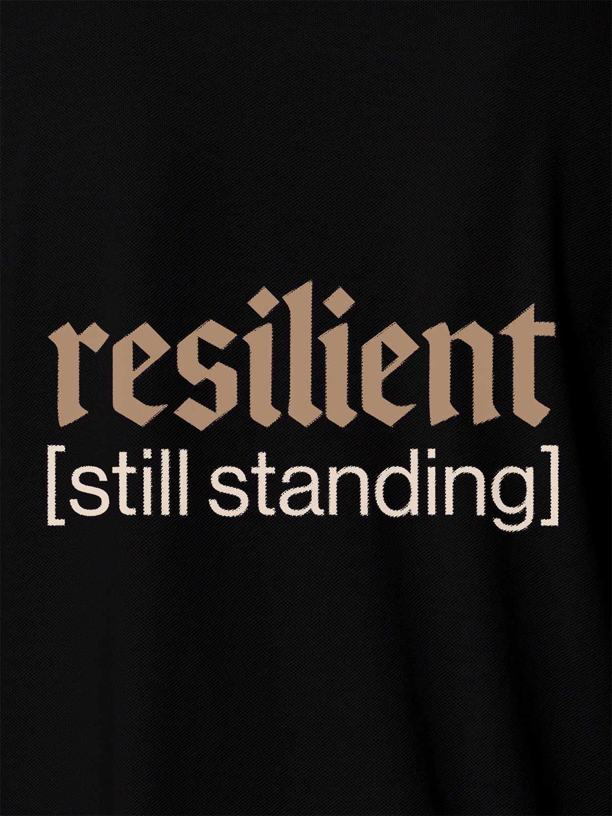 Close up of 'Resilient' design on Men's Black Polo T-shirt, highlighting intricate details and vibrant print.