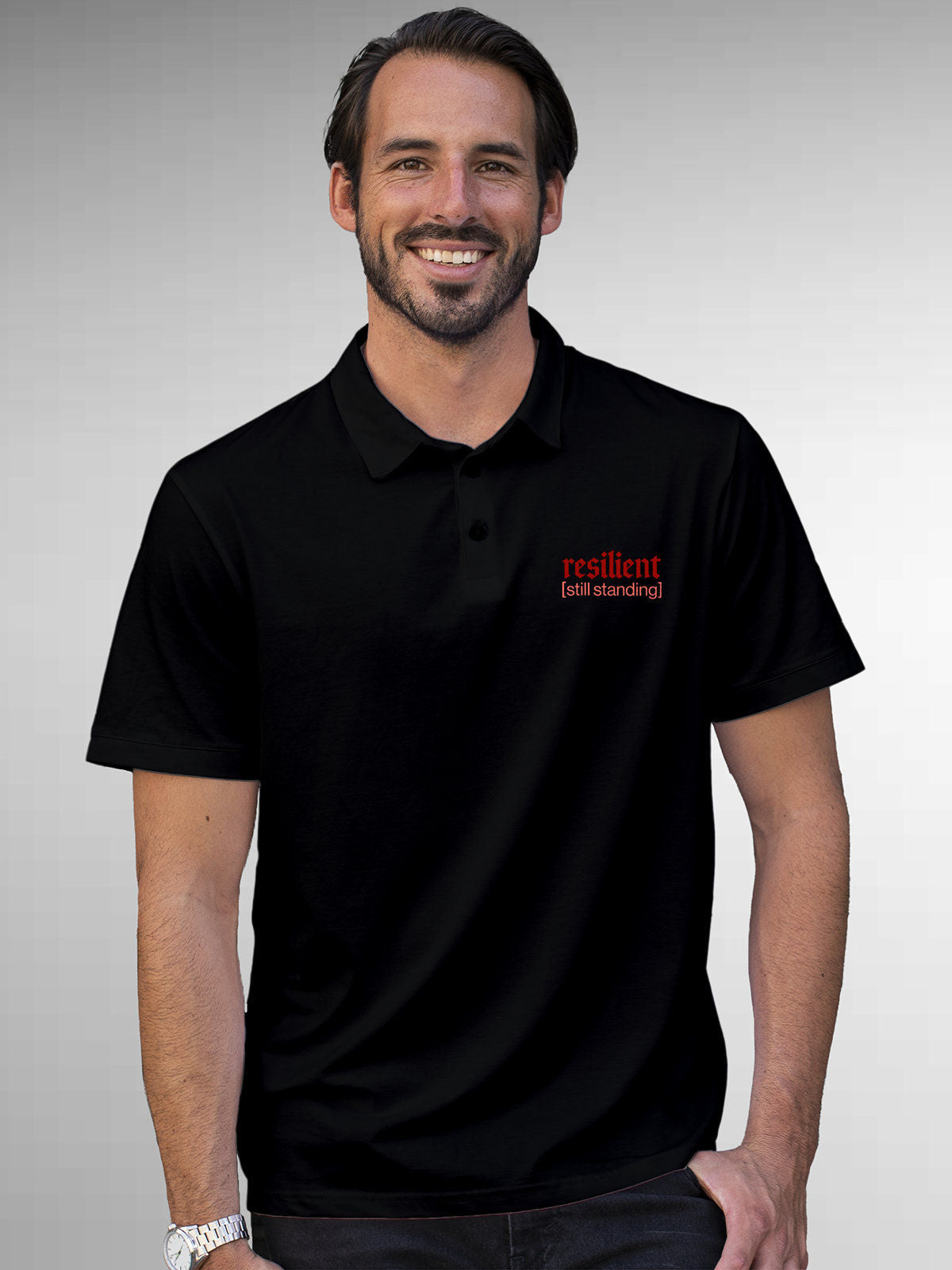 Model wearing Men's Black Polo T-shirt with 'Resilient' design, offering effortless style and premium comfort