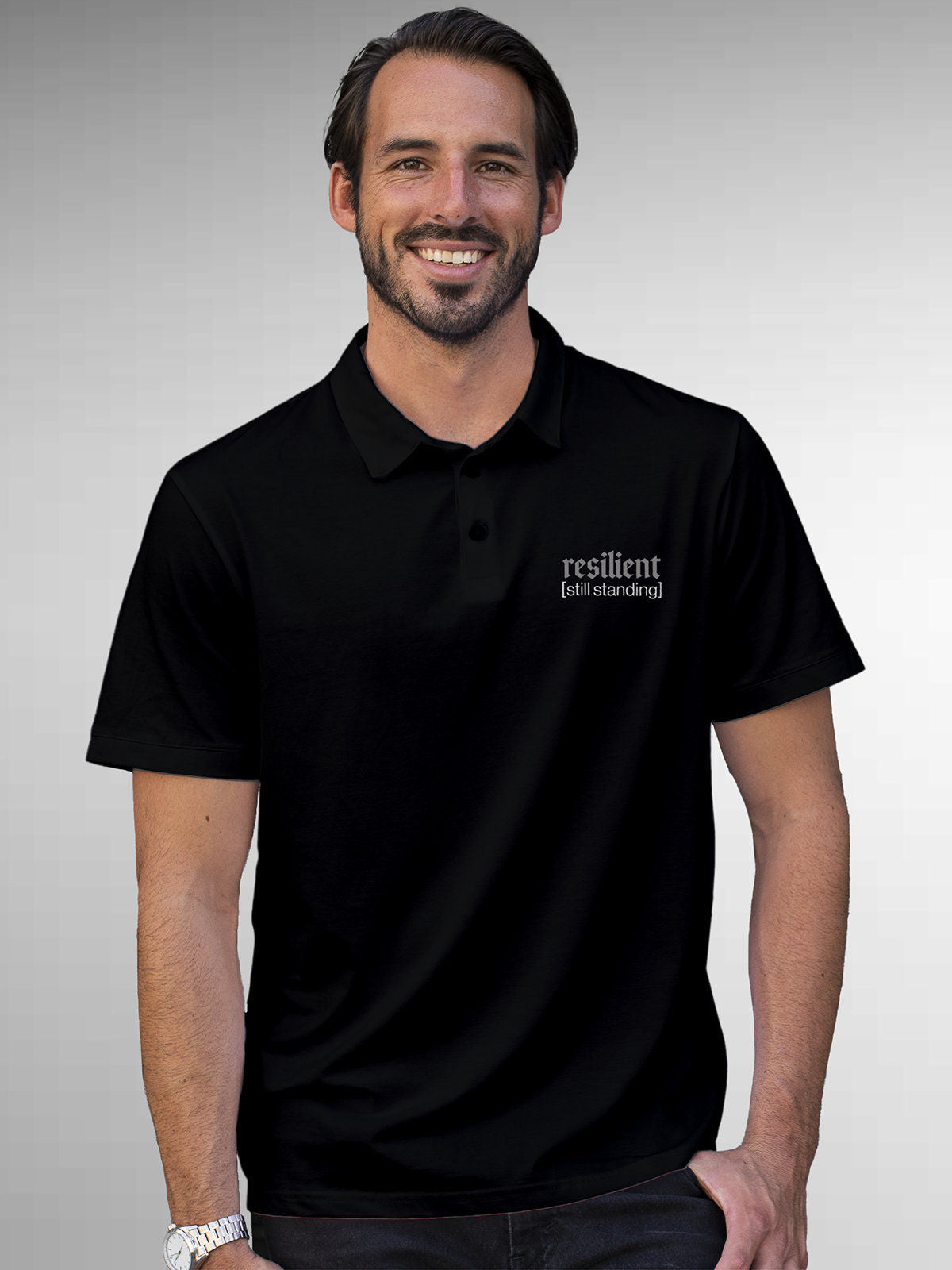 Model wearing Men's Black Polo T-shirt with 'Resilient' design, offering effortless style and premium comfort