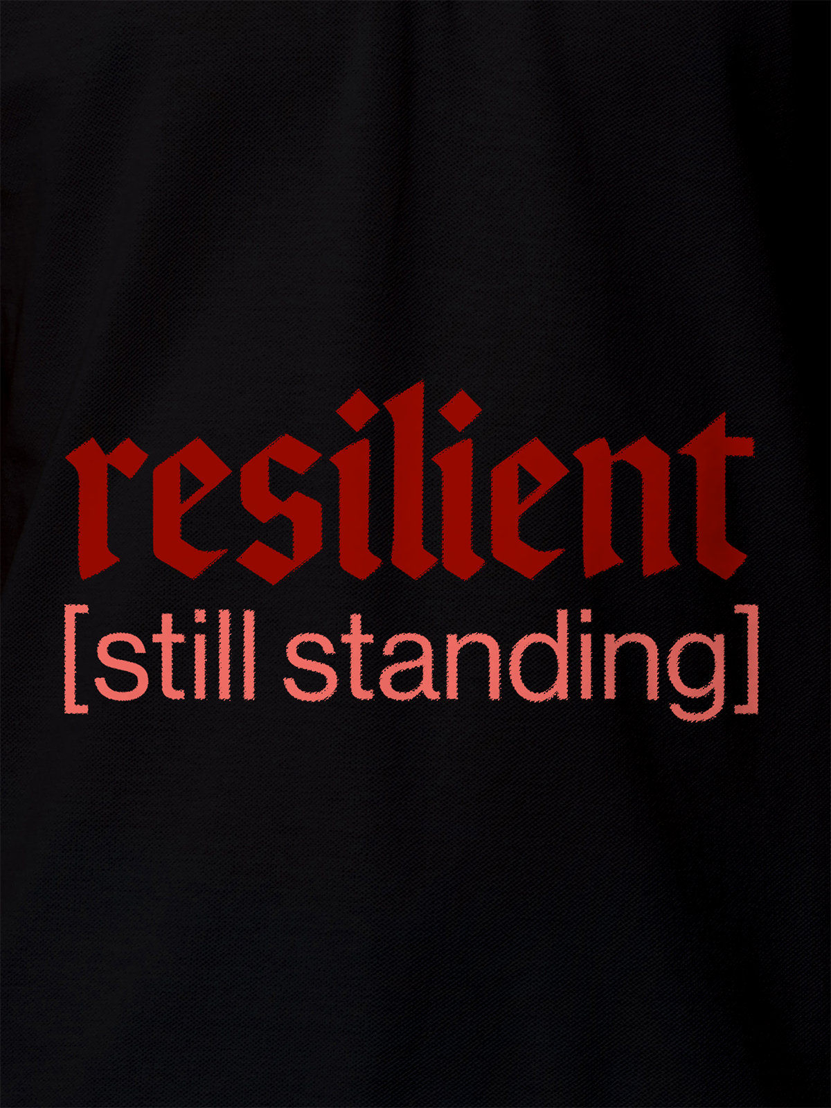 Close up of 'Resilient' design on Women's Black Polo T-shirt, highlighting intricate details and vibrant print.