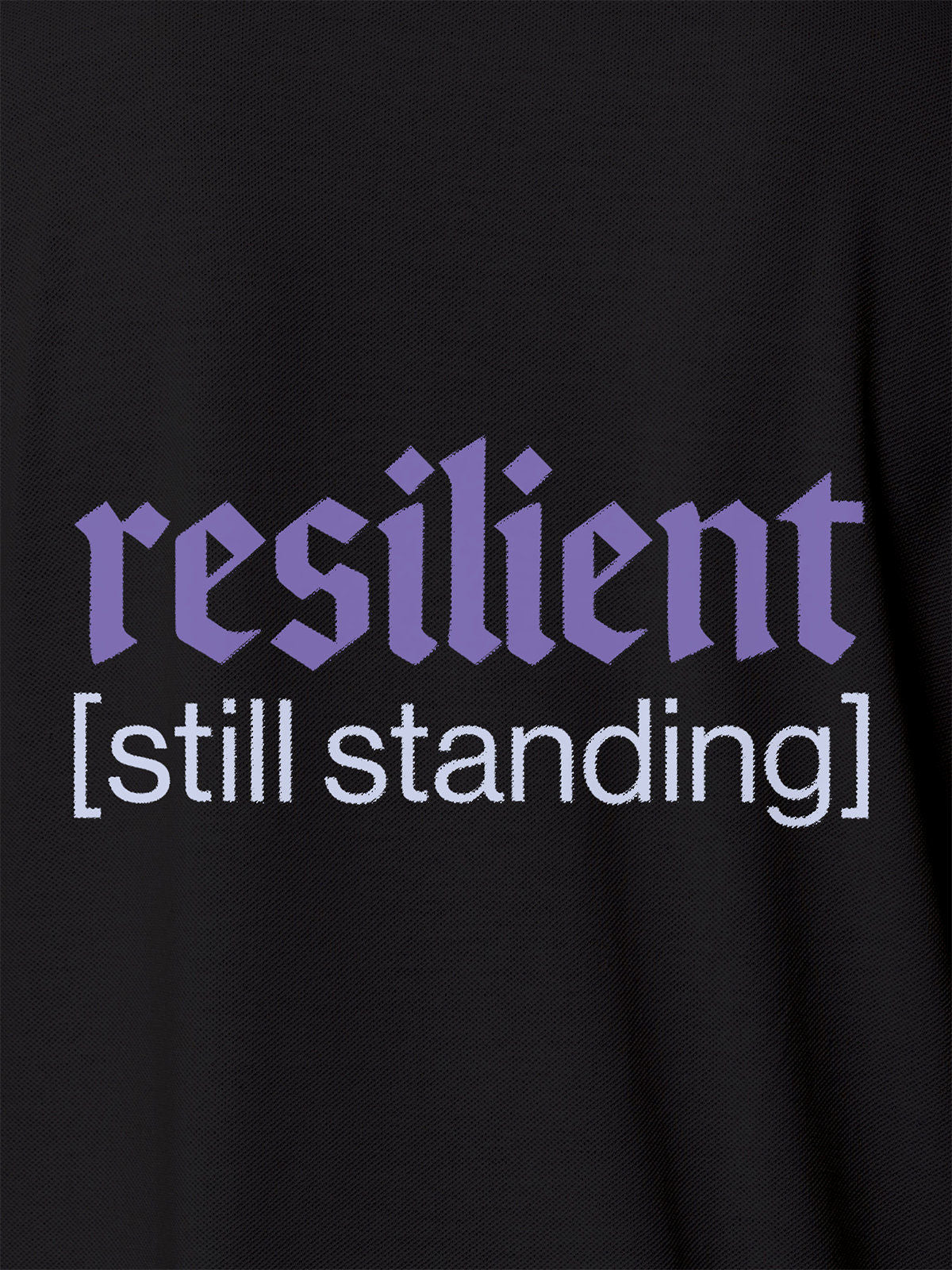 Close up of 'Resilient' design on Men's Dark Grey Polo T-shirt, highlighting intricate details and vibrant print.