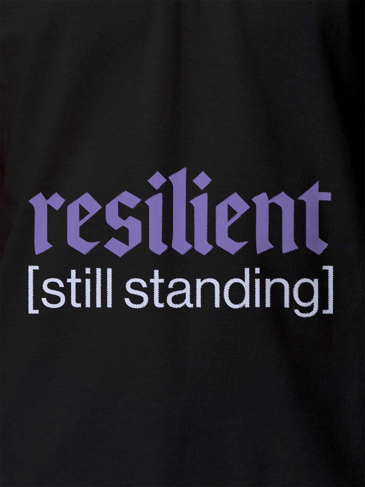 Close up of 'Resilient' design on Women's Dark Grey Polo T-shirt, highlighting intricate details and vibrant print.