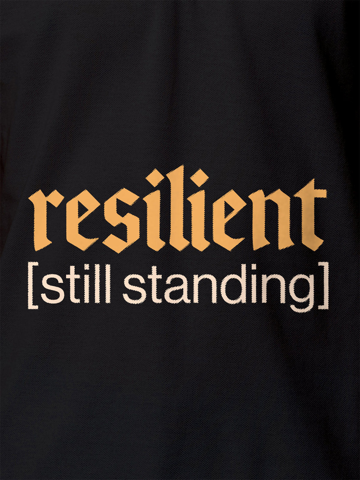 Close up of 'Resilient' design on Women's Dark Grey Polo T-shirt, highlighting intricate details and vibrant print.