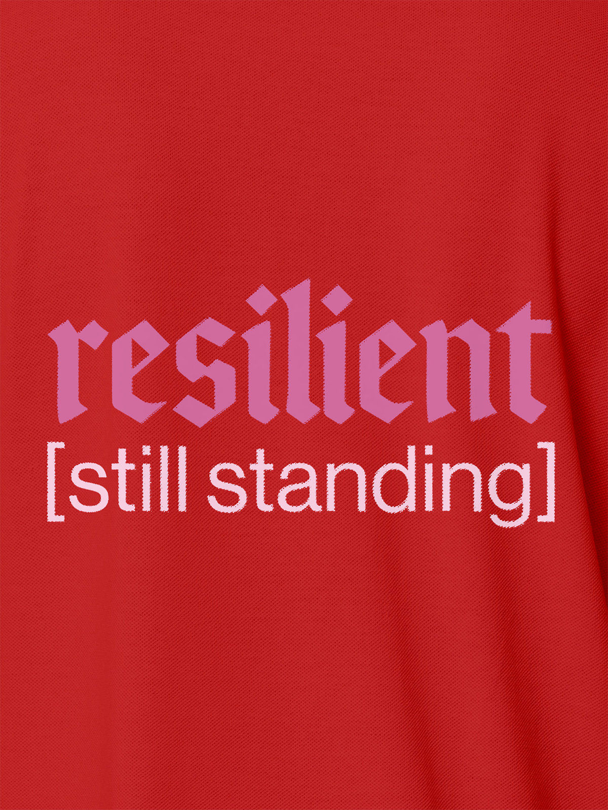 Close up of 'Resilient' design on Men's Red Polo T-shirt, highlighting intricate details and vibrant print.
