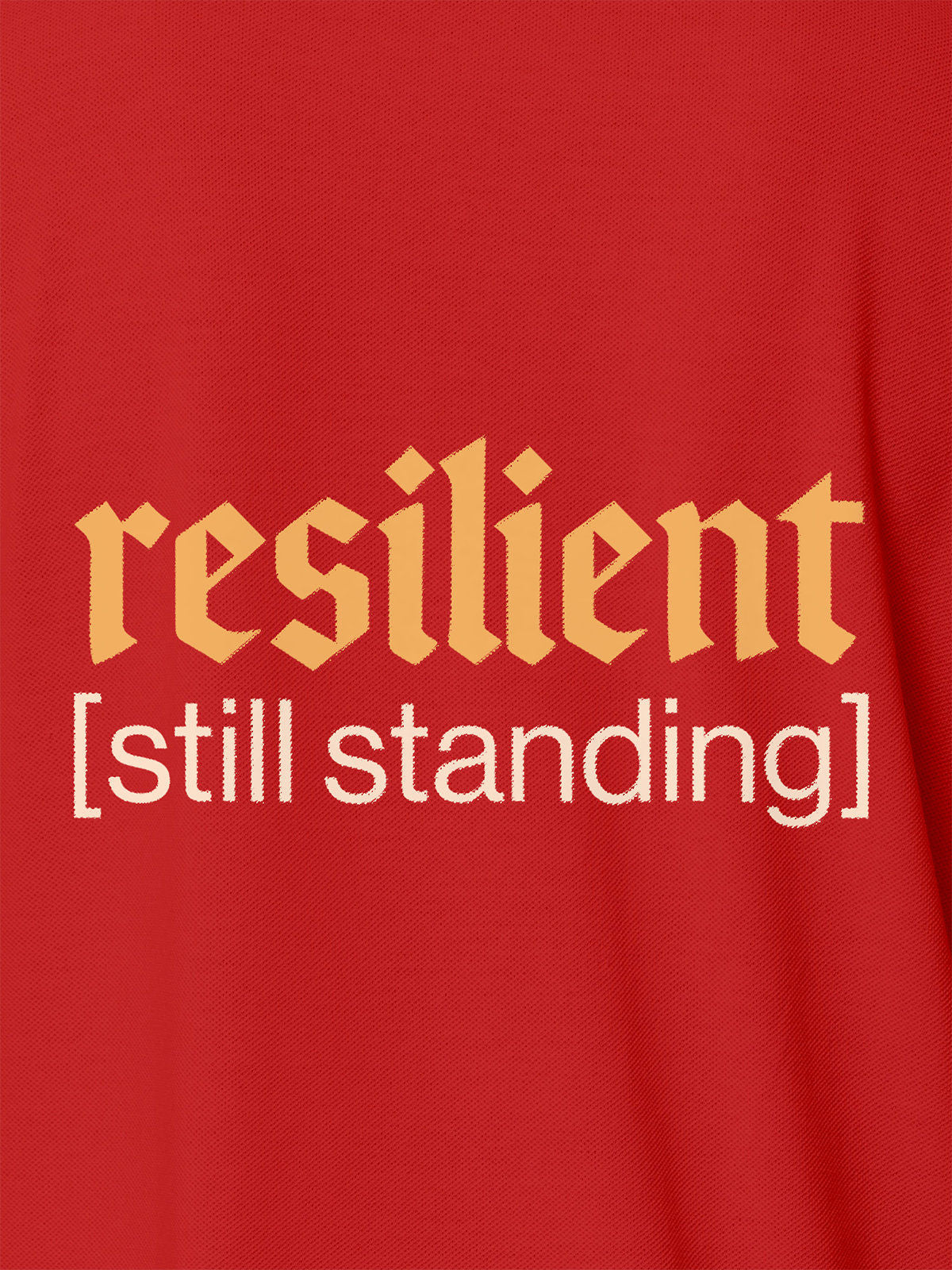 Close up of 'Resilient' design on Men's Red Polo T-shirt, highlighting intricate details and vibrant print.