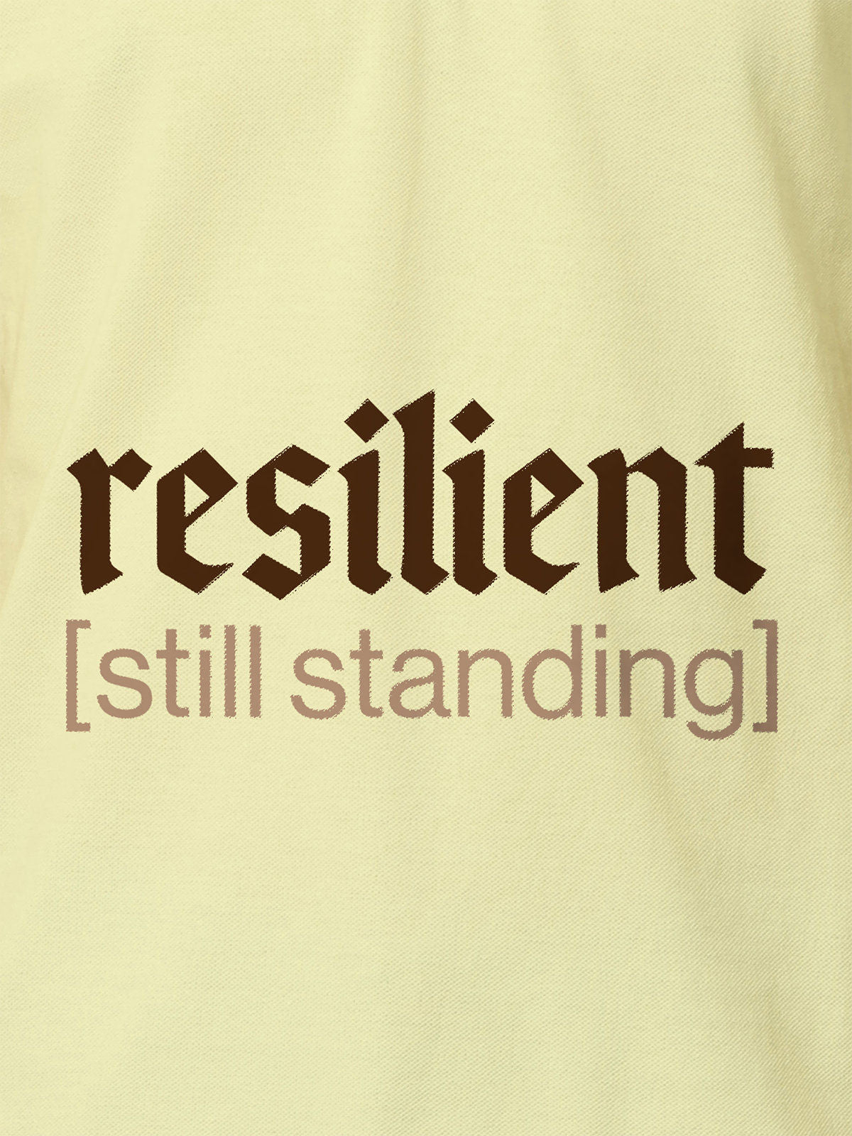Close up of 'Resilient' design on Women's Yellow Polo T-shirt, highlighting intricate details and vibrant print.