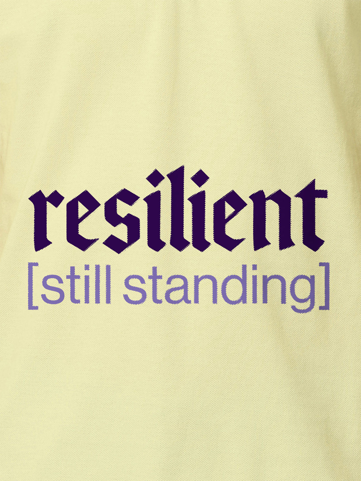 Close up of 'Resilient' design on Women's Yellow Polo T-shirt, highlighting intricate details and vibrant print.