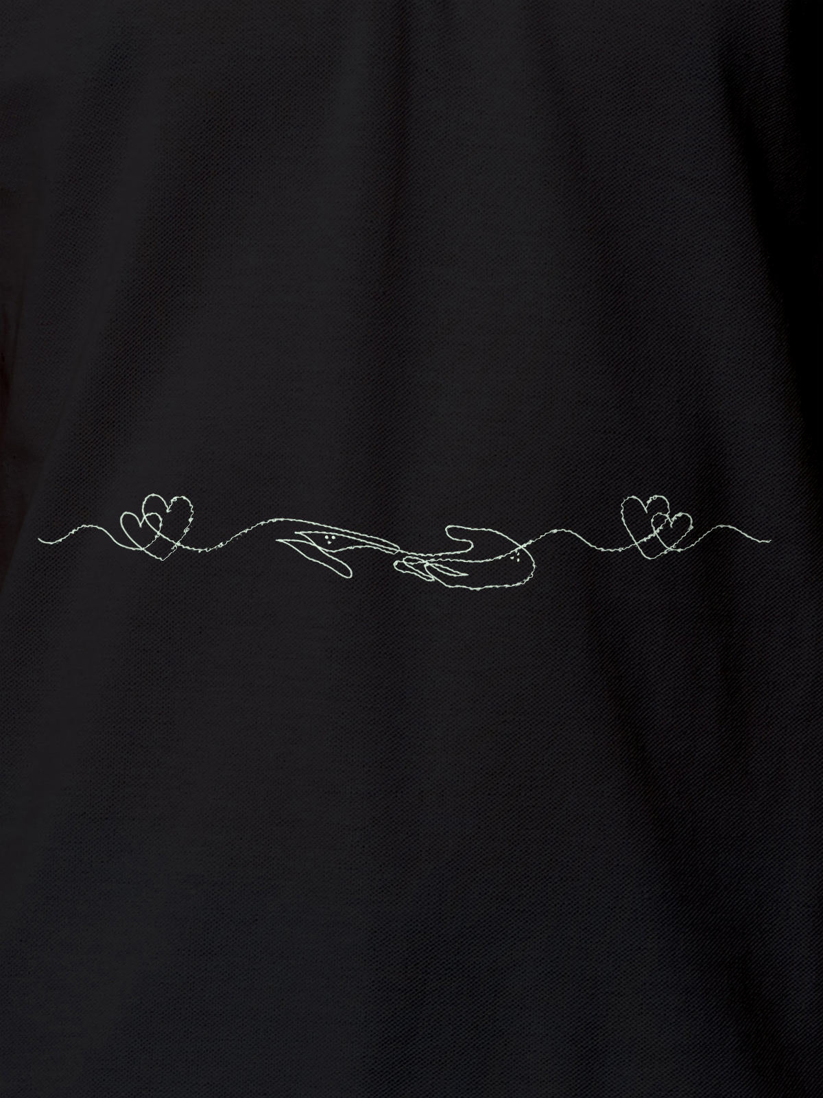 Close up of 'Empathy' design on Women's Dark Grey Polo T-shirt, highlighting intricate details and vibrant print.
