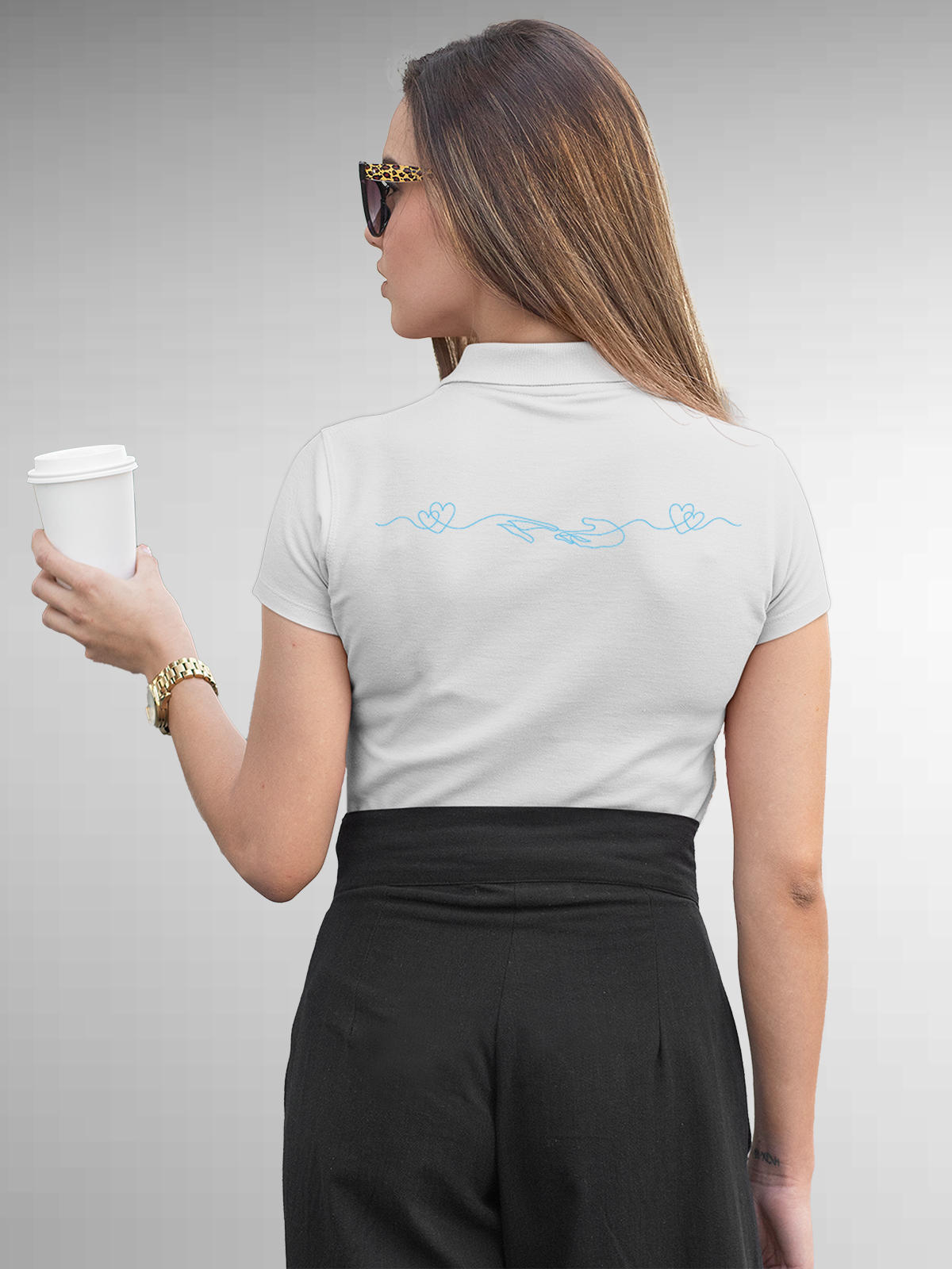 Model wearing Women's White Polo T-shirt with 'Empathy' design, offering effortless style and premium comfort