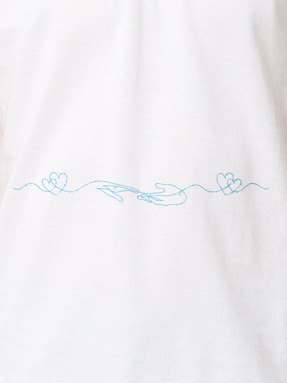 Close up of 'Empathy' design on Women's White Polo T-shirt, highlighting intricate details and vibrant print.