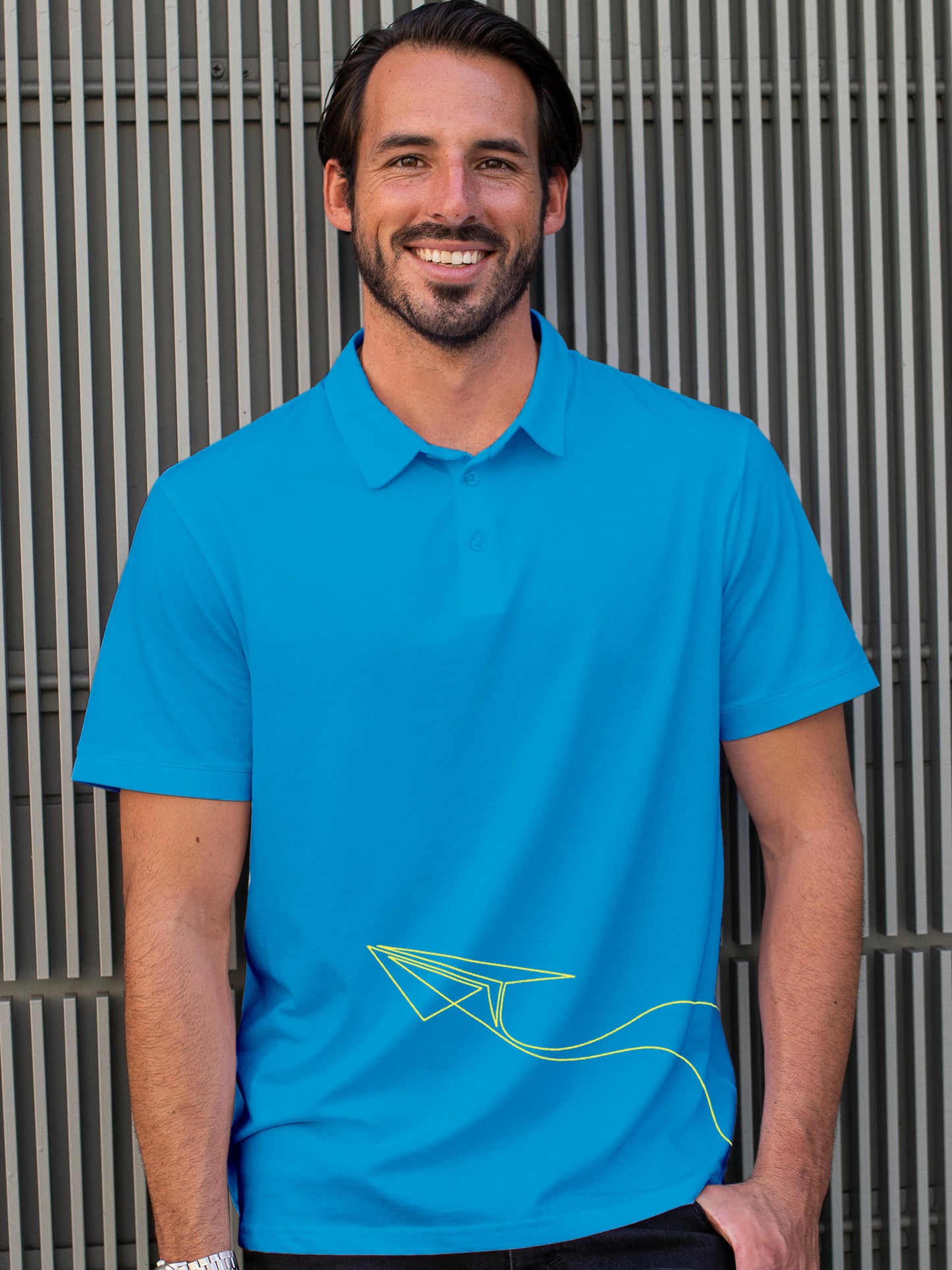 Model wearing Men's Blue Polo T-shirt with 'Empowered' design, offering effortless style and premium comfort