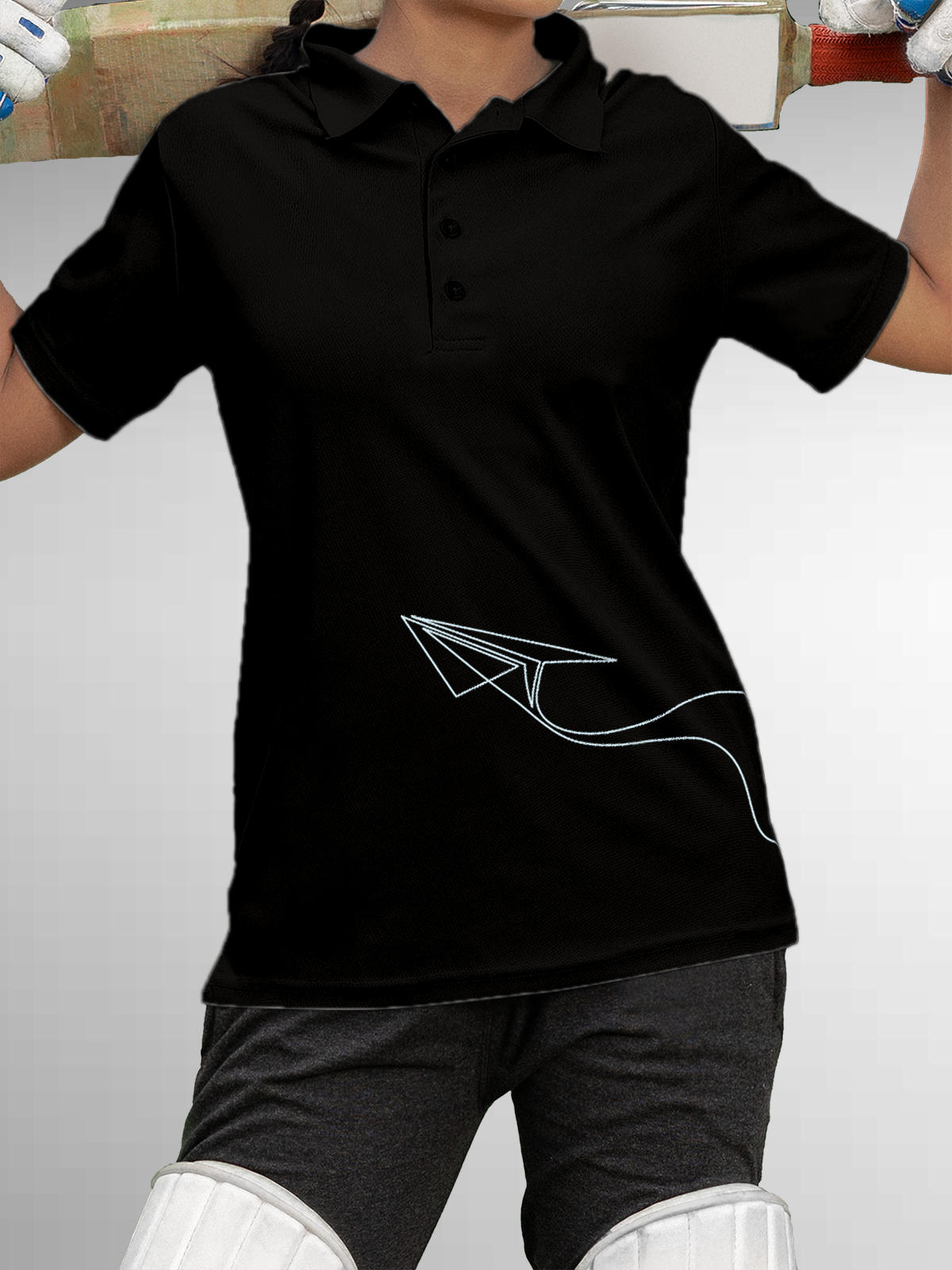 Model wearing Women's Black Polo T-shirt with 'Empowered' design, offering effortless style and premium comfort