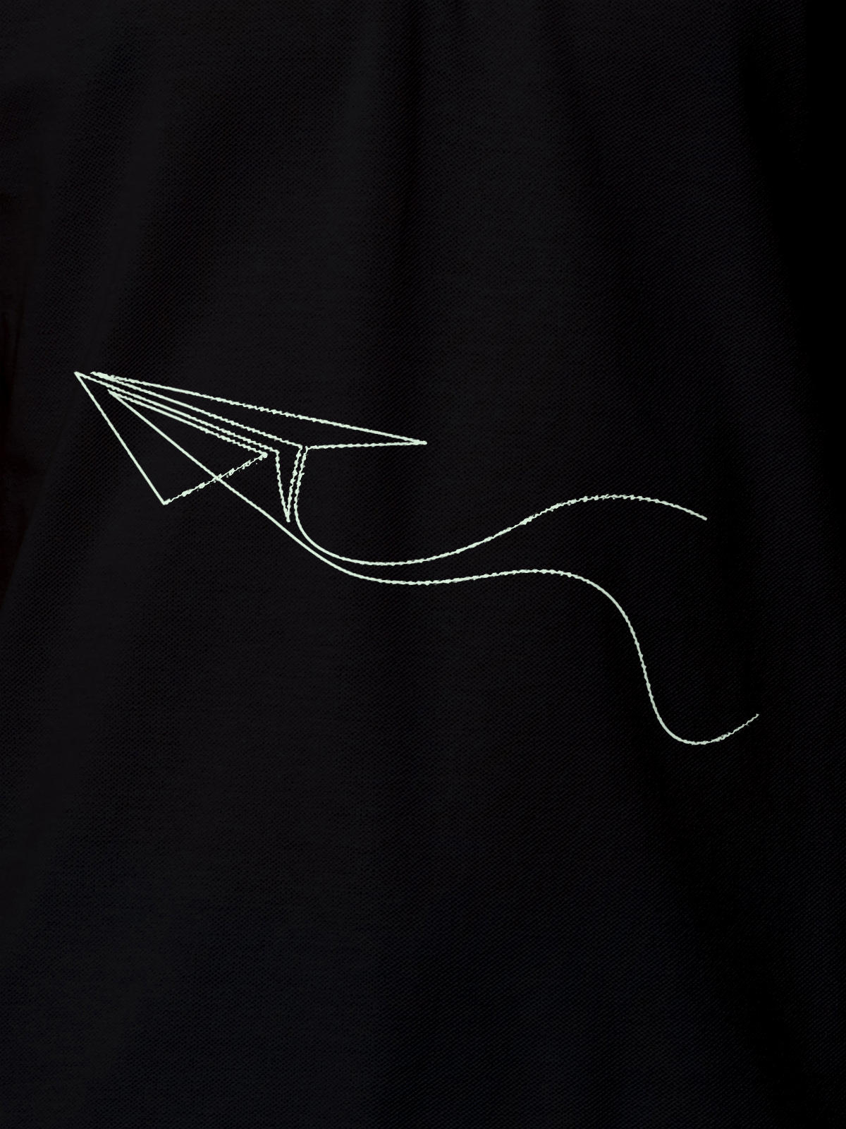 Close up of 'Empowered' design on Women's Black Polo T-shirt, highlighting intricate details and vibrant print.