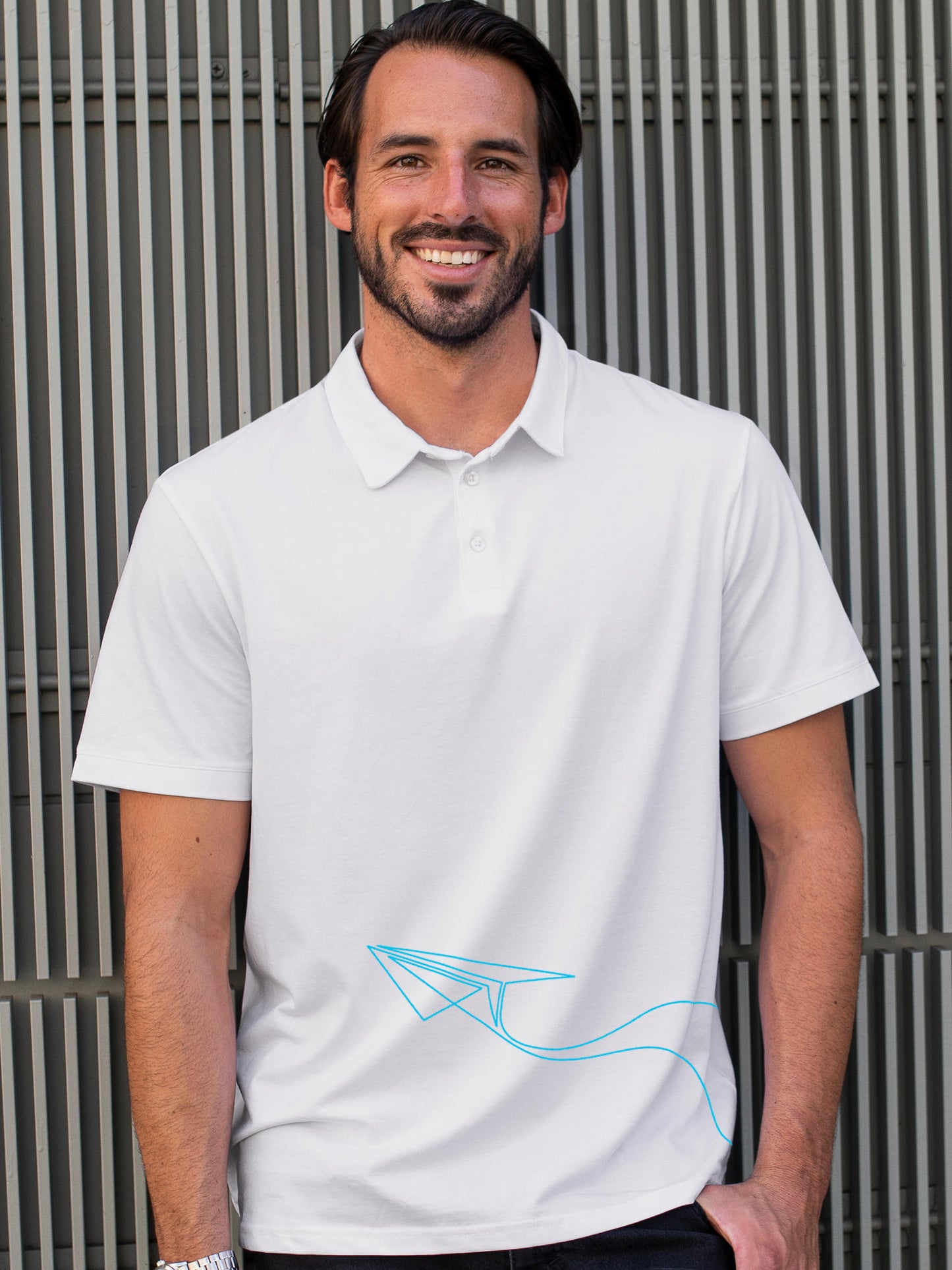 Model wearing Men's White Polo T-shirt with 'Empowered' design, offering effortless style and premium comfort