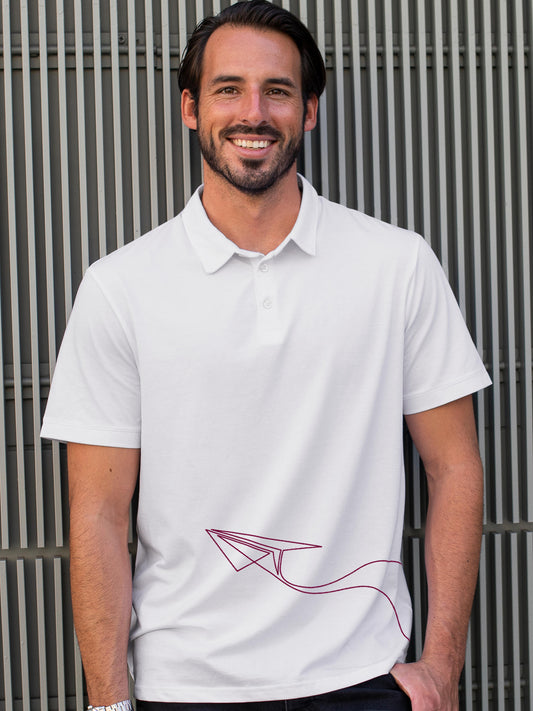 Model wearing Men's White Polo T-shirt with 'Empowered' design, offering effortless style and premium comfort