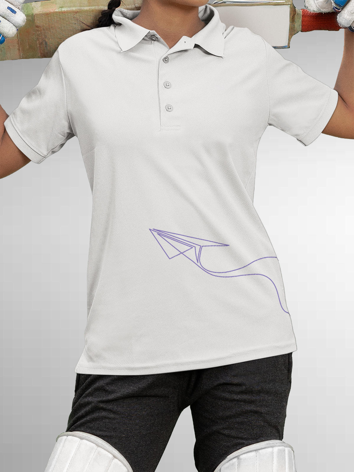 Model wearing Women's White Polo T-shirt with 'Empowered' design, offering effortless style and premium comfort