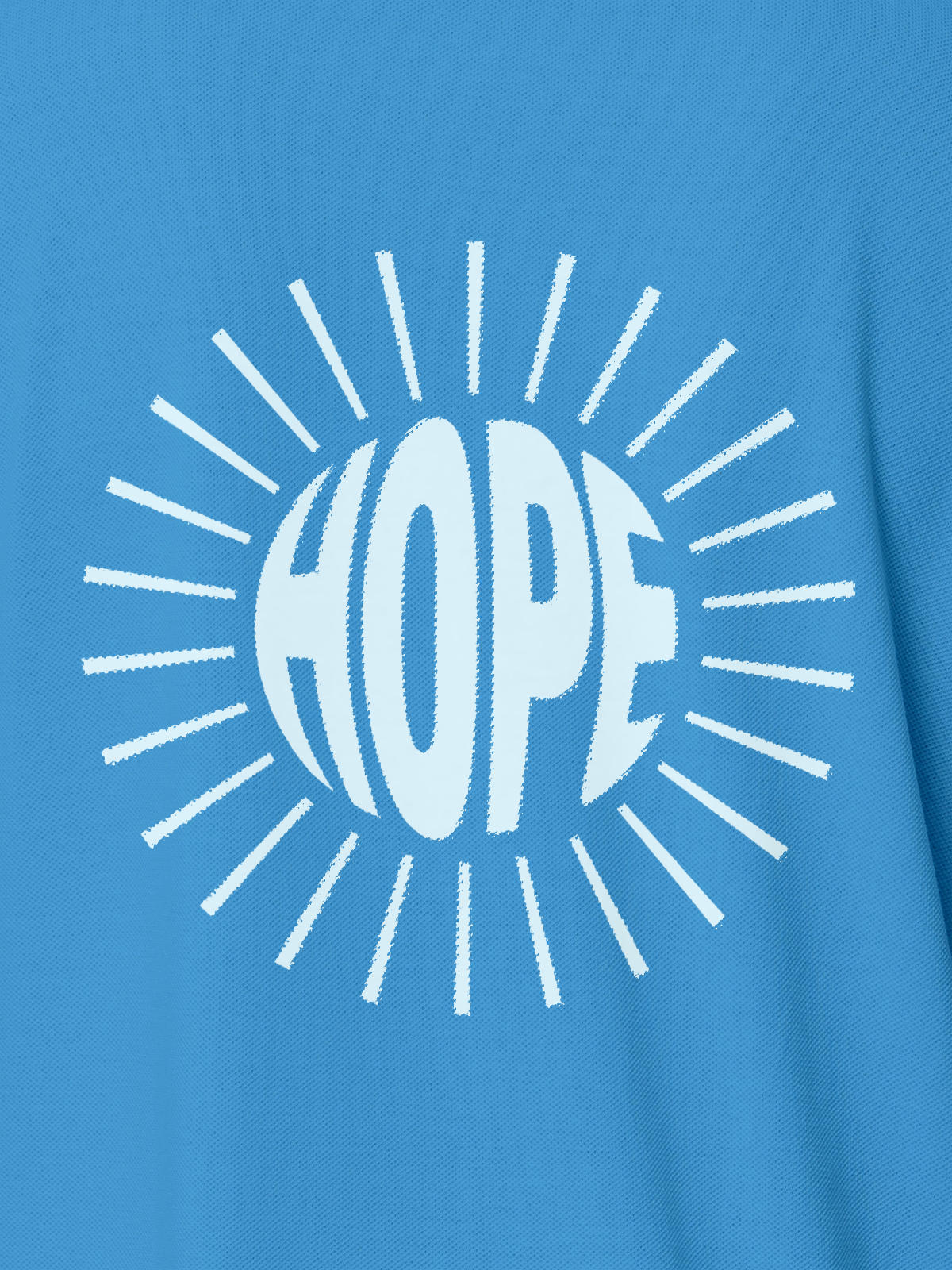 Close up of 'Hope' design on Women's Blue Polo T-shirt, highlighting intricate details and vibrant print.