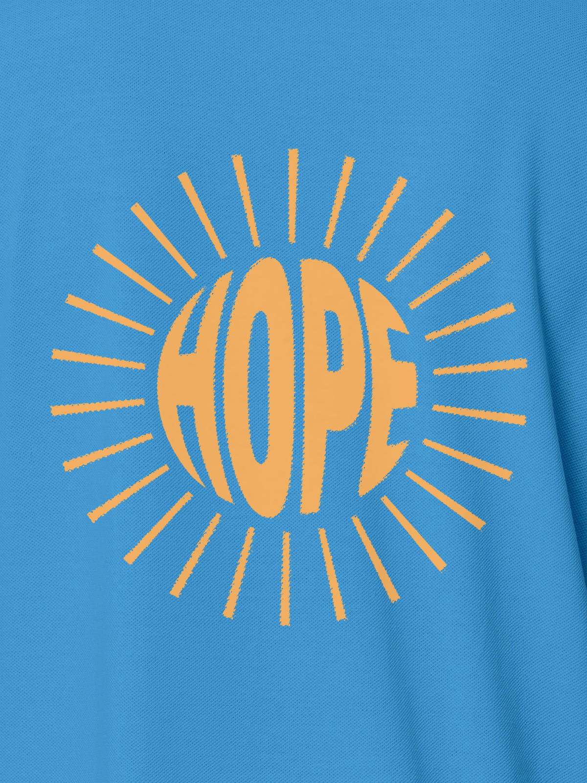 Close up of 'Hope' design on Women's Blue Polo T-shirt, highlighting intricate details and vibrant print.