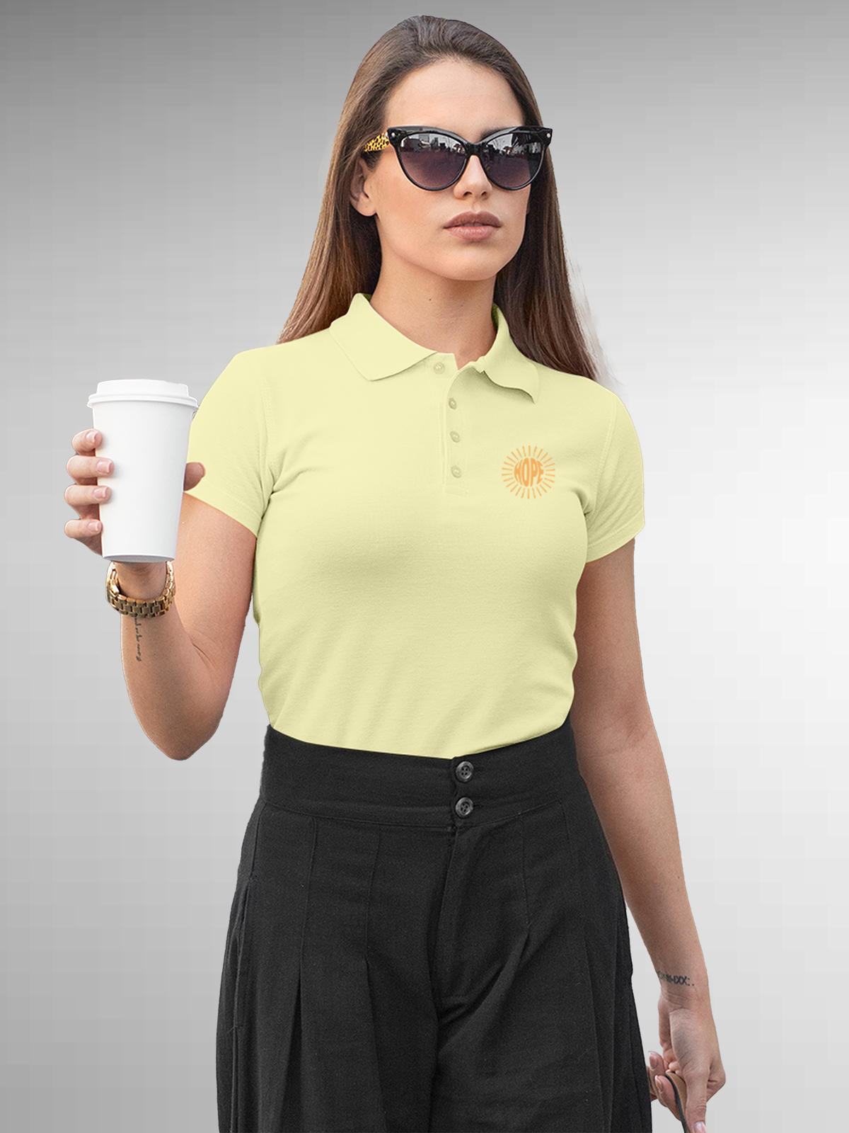Model wearing Women's Yellow Polo T-shirt with 'Hope' design, offering effortless style and premium comfort