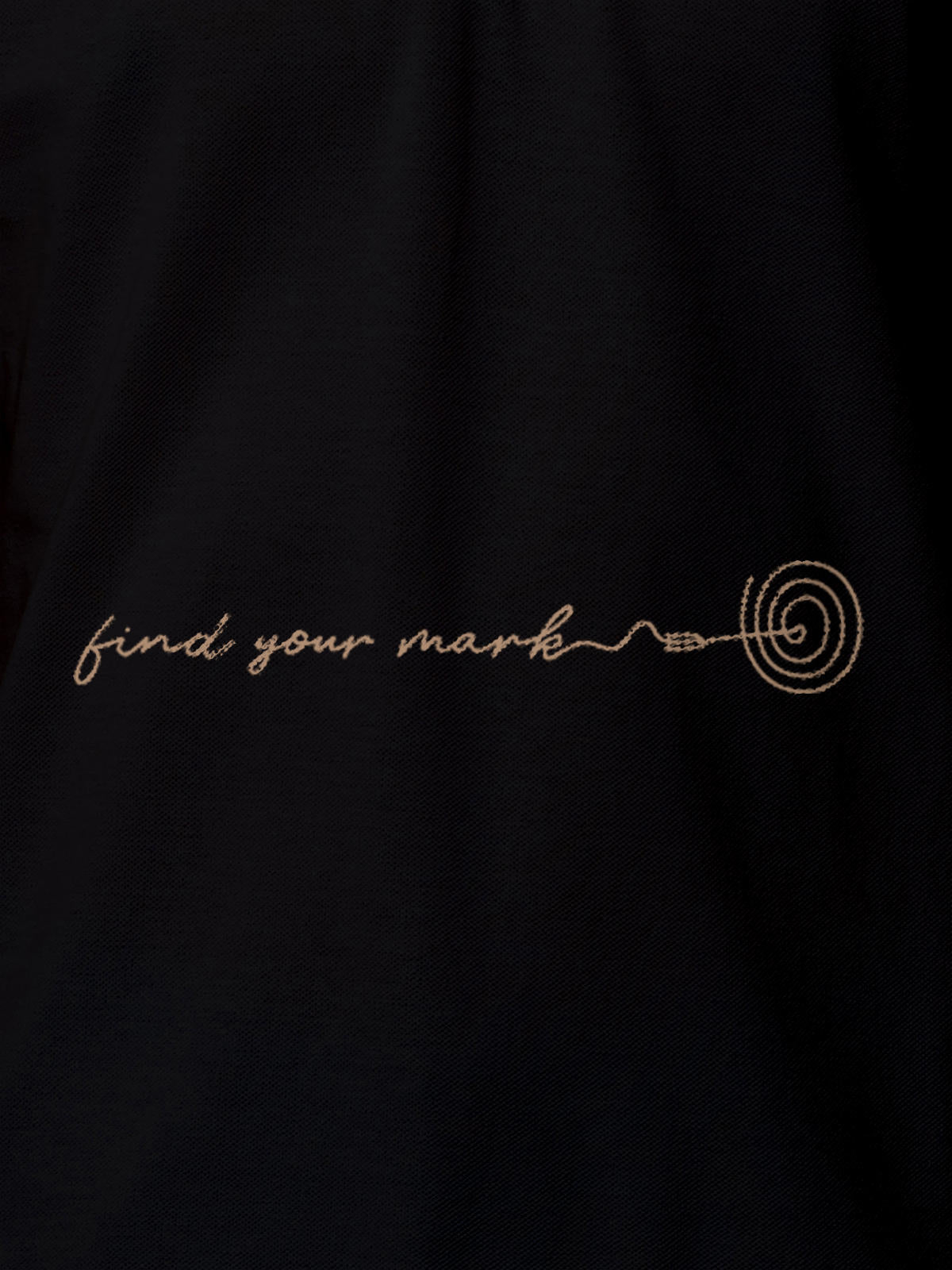Close up of 'Find Your Mark' design on Men's Black Polo T-shirt, highlighting intricate details and vibrant print.