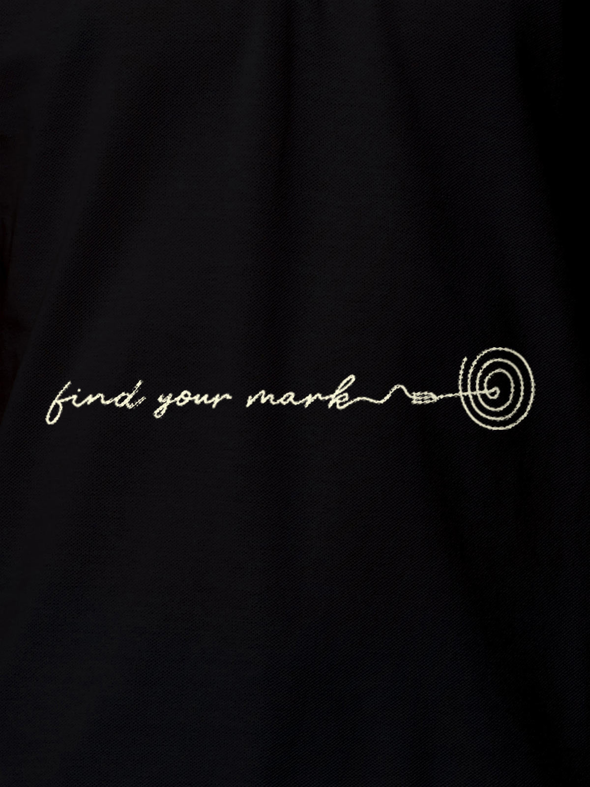 Close up of 'Find Your Mark' design on Men's Black Polo T-shirt, highlighting intricate details and vibrant print.