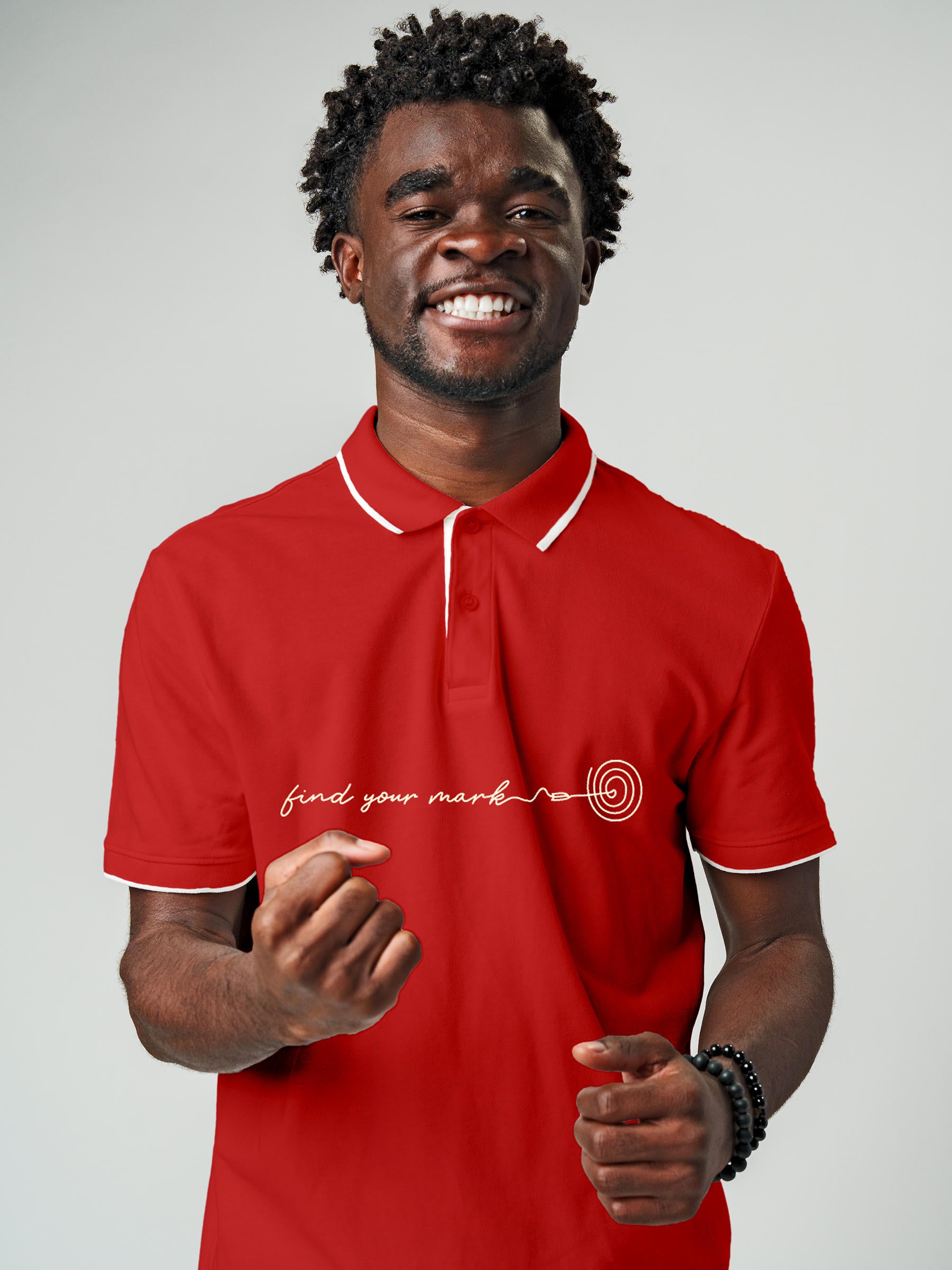 Model wearing Men's Red Polo T-shirt with 'Find Your Mark' design, offering effortless style and premium comfort