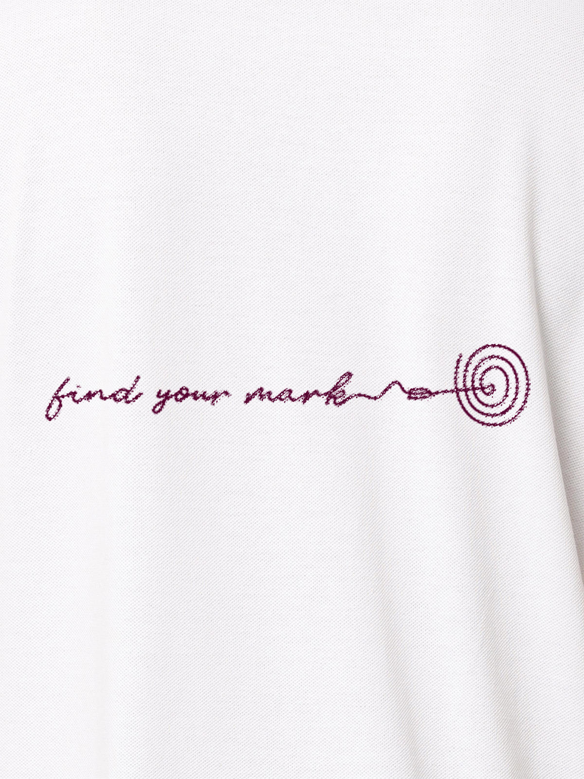 Close up of 'Find Your Mark' design on Women's White Polo T-shirt, highlighting intricate details and vibrant print.