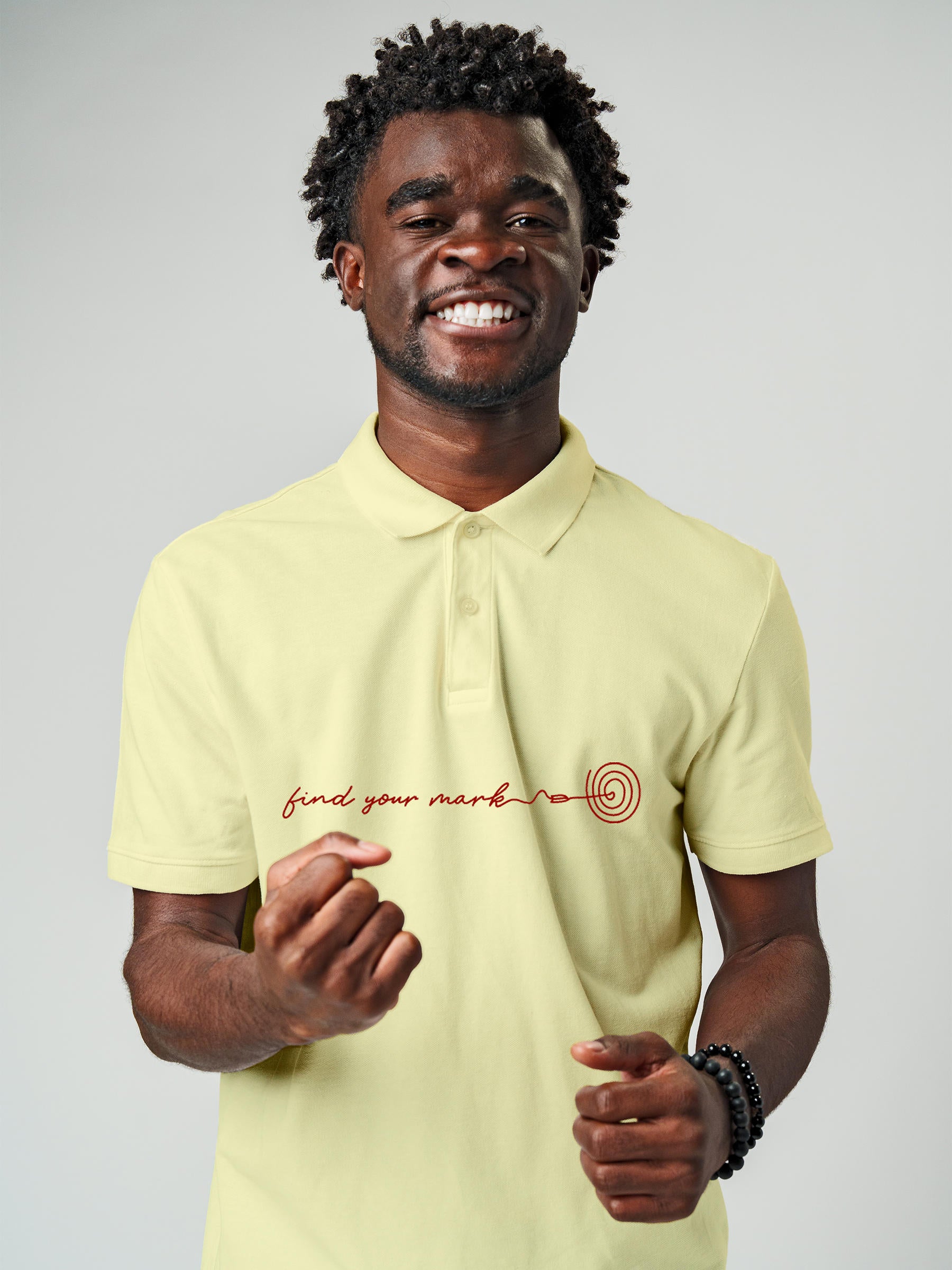 Model wearing Men's Yellow Polo T-shirt with 'Find Your Mark' design, offering effortless style and premium comfort