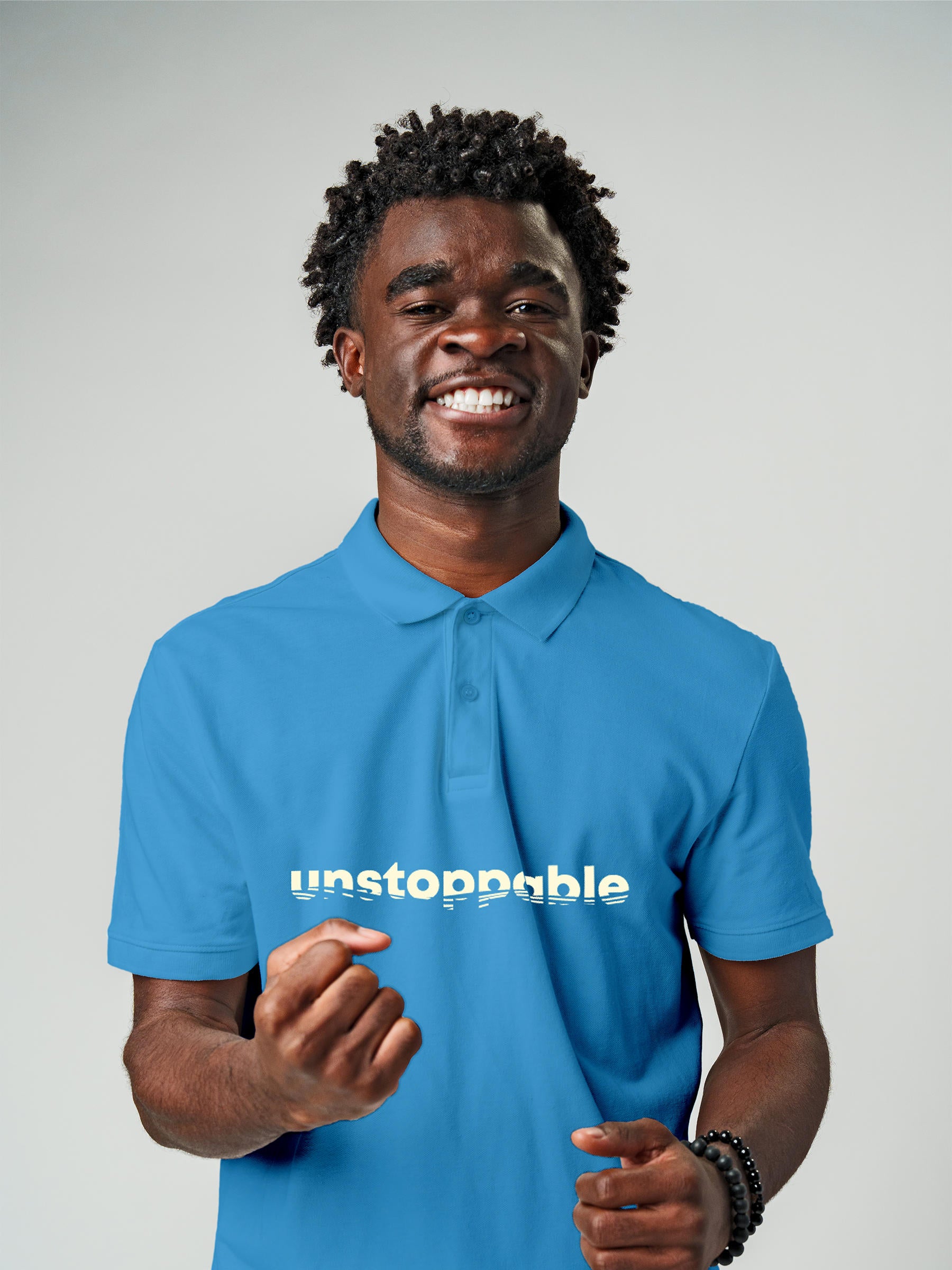 Model wearing Men's Blue Polo T-shirt with 'Unstoppable' design, offering effortless style and premium comfort