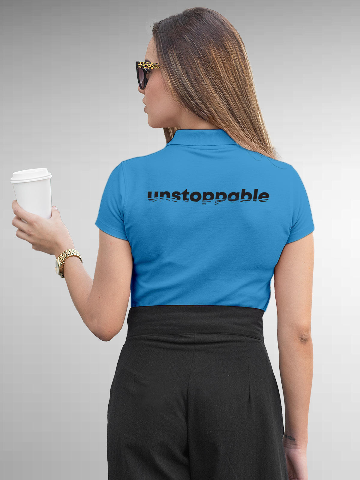 Model wearing Women's Blue Polo T-shirt with 'Unstoppable' design, offering effortless style and premium comfort