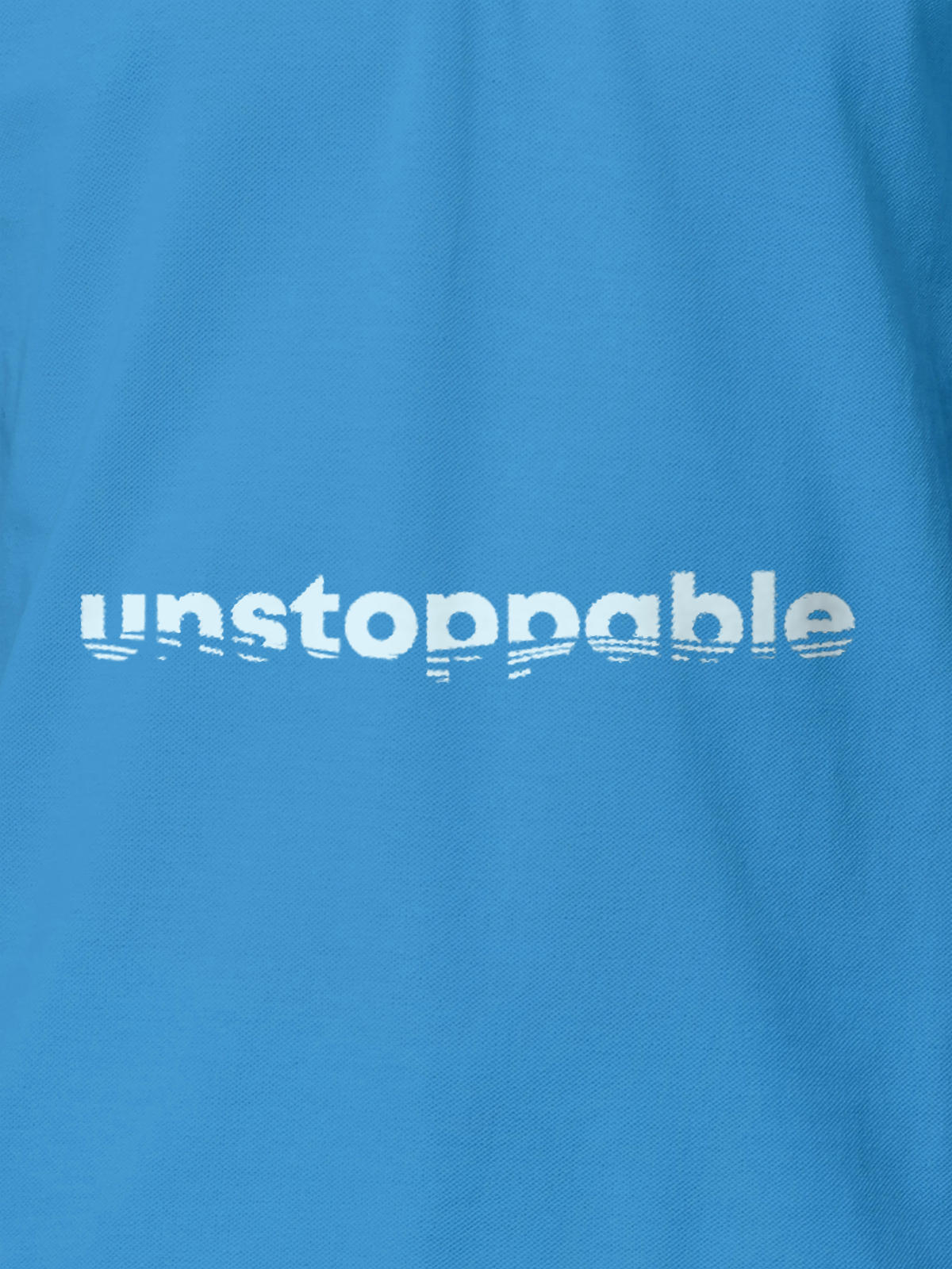 Close up of 'Unstoppable' design on Women's Blue Polo T-shirt, highlighting intricate details and vibrant print.