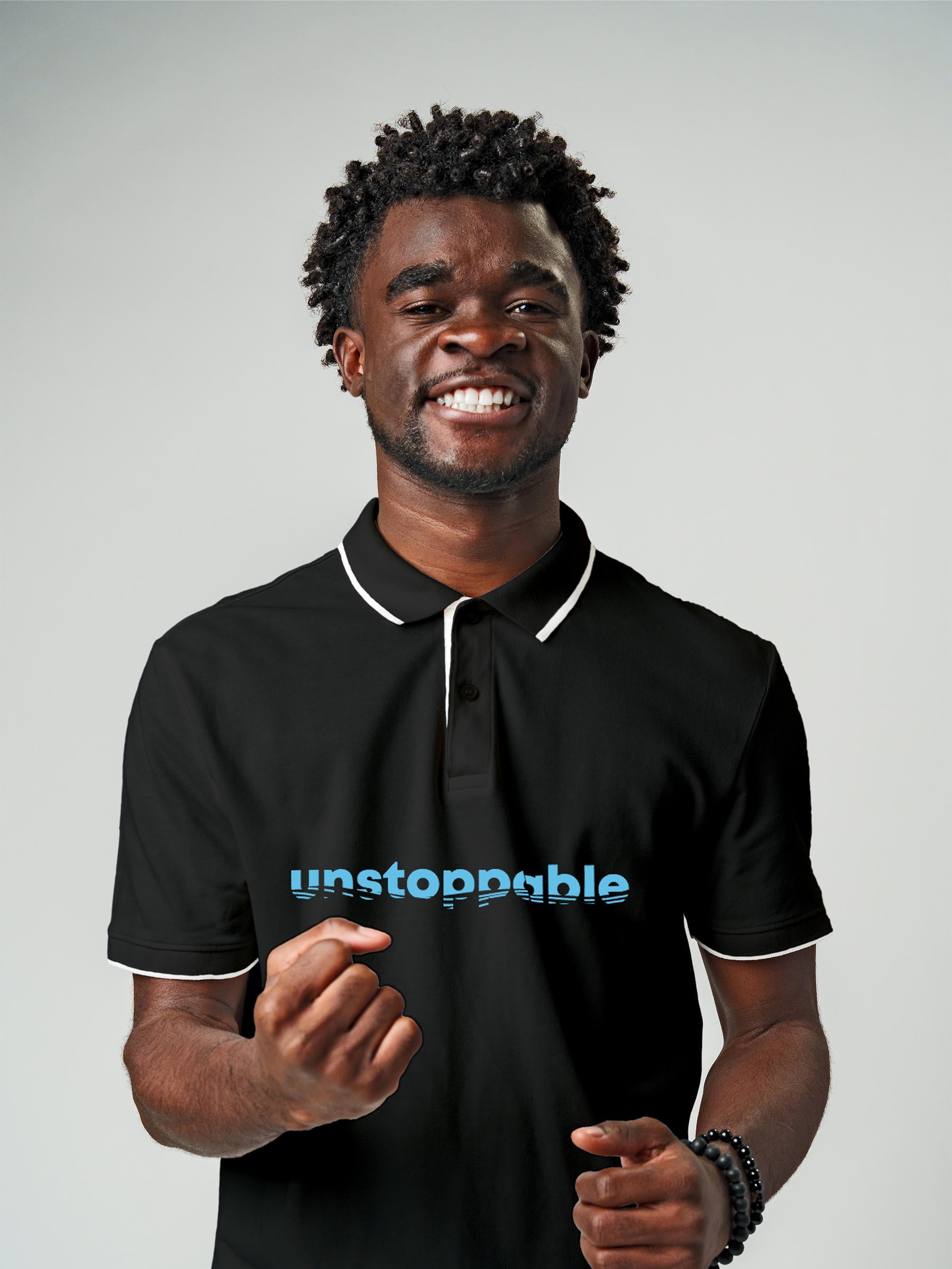 Model wearing Men's Dark Grey Polo T-shirt with 'Unstoppable' design, offering effortless style and premium comfort