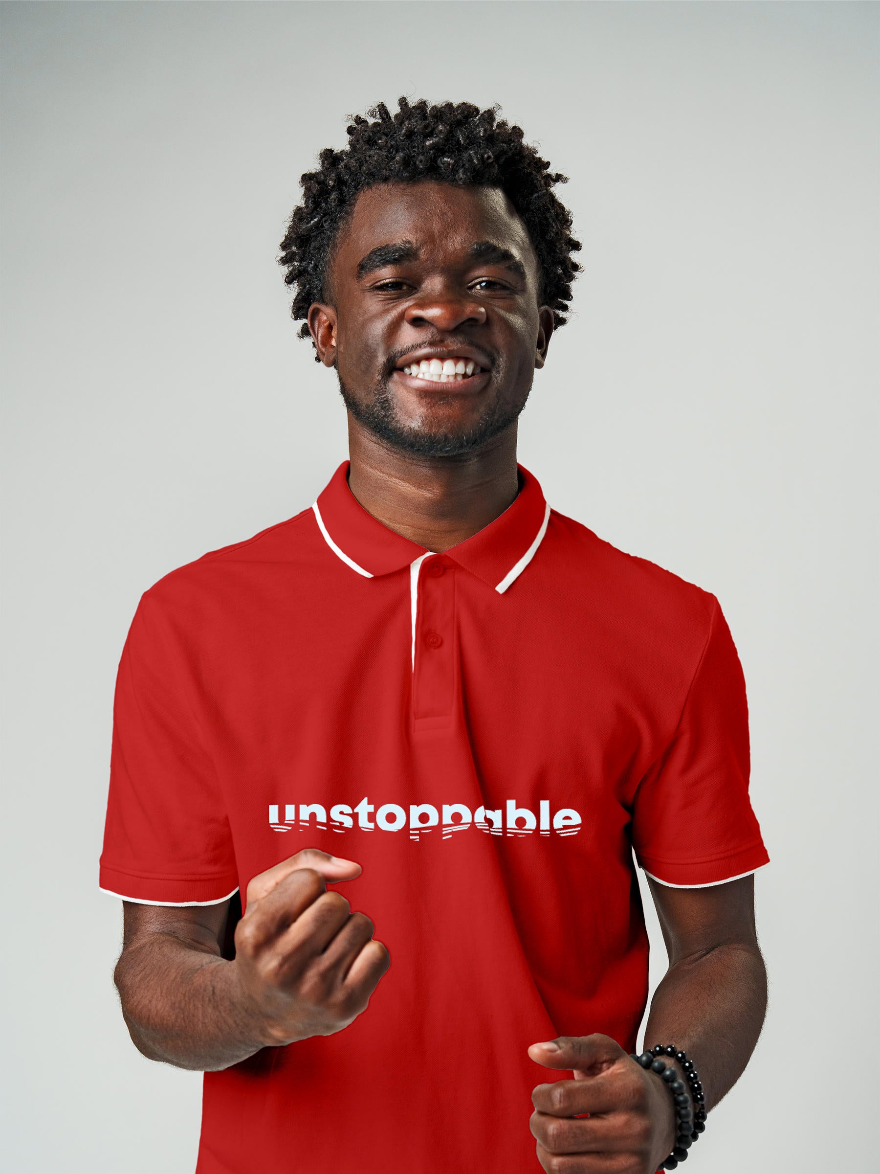Model wearing Men's Red Polo T-shirt with 'Unstoppable' design, offering effortless style and premium comfort