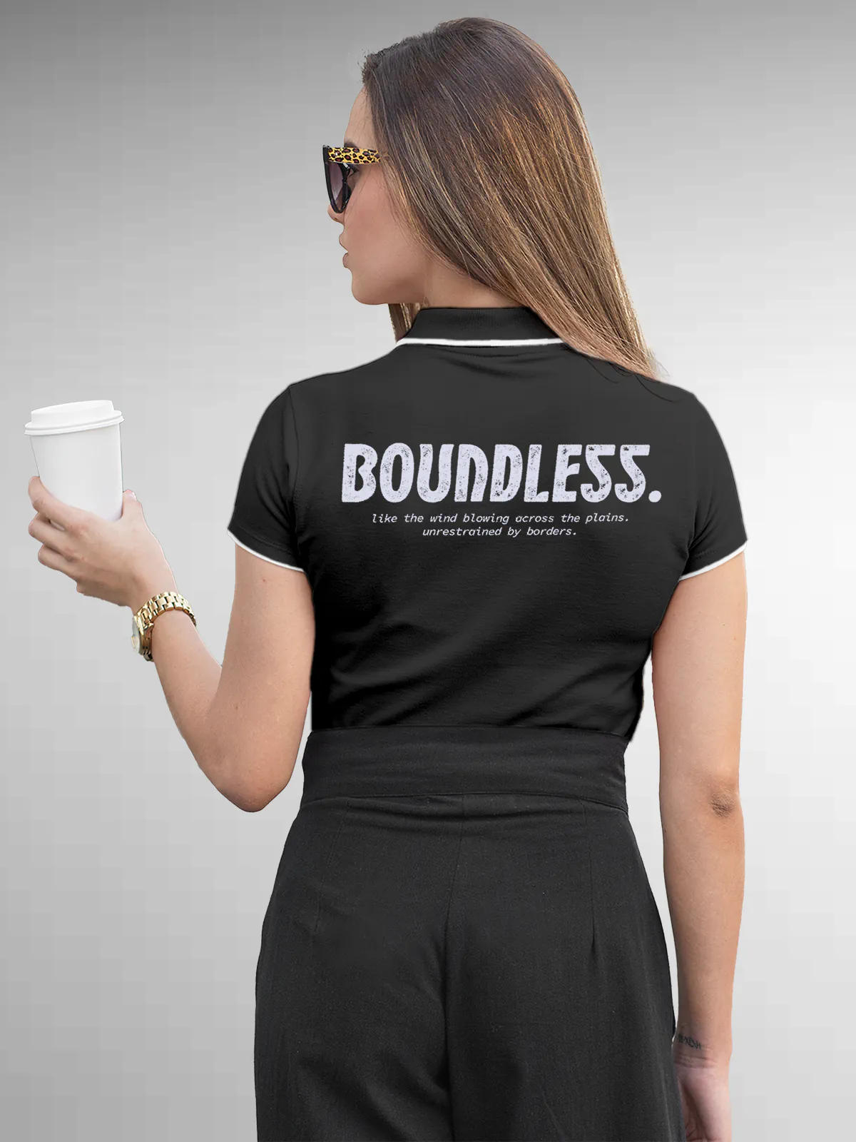 Model wearing Women's Dark Grey Collar T-shirt with a big, bold 'Boundless' design printed on the back, along with an insiprational text
