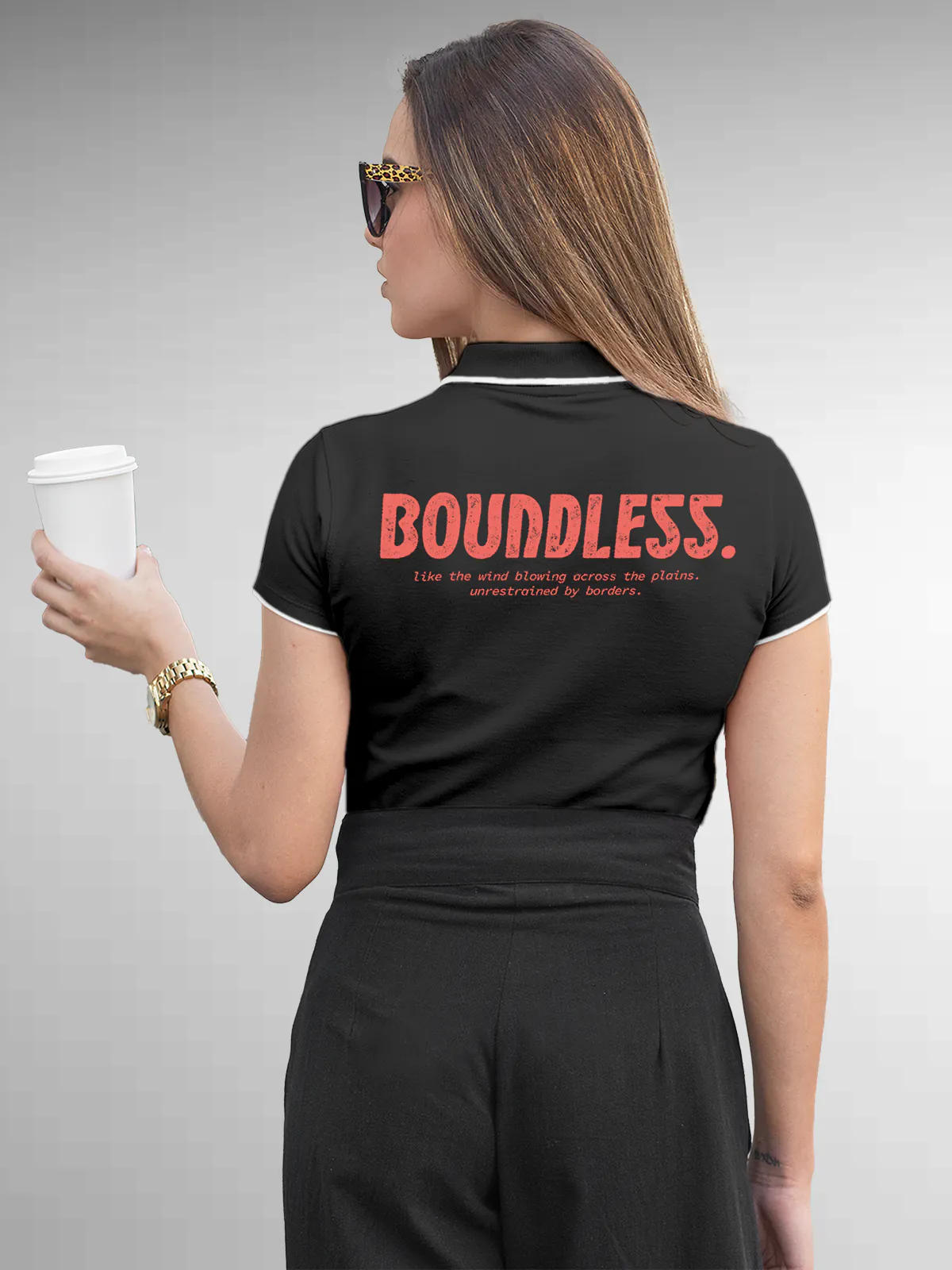 Model wearing Women's Dark Grey Collar T-shirt with a big, bold 'Boundless' design printed on the back, along with an insiprational text