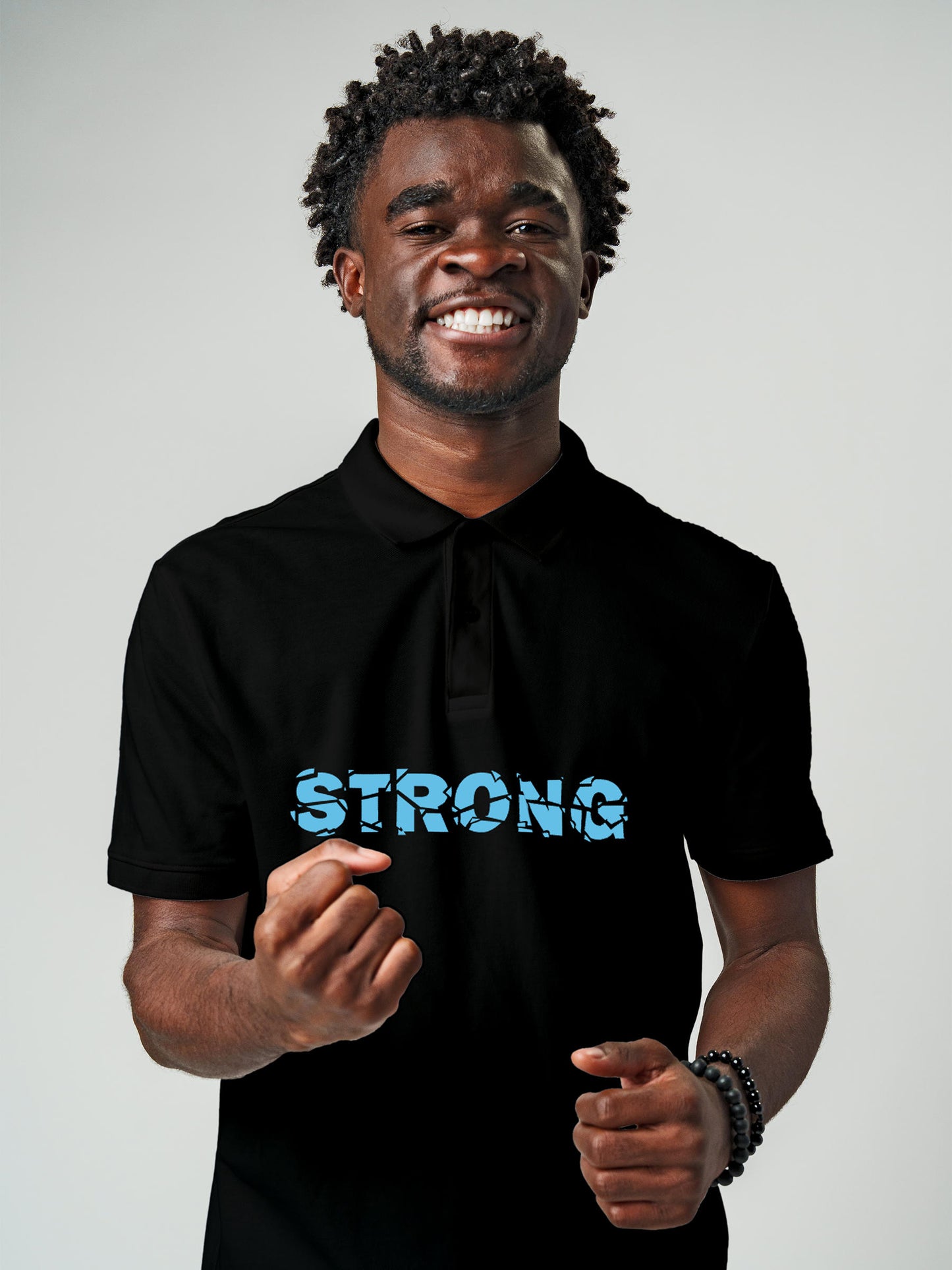 Model wearing Men's Black Polo T-shirt with 'Strong' design, offering effortless style and premium comfort