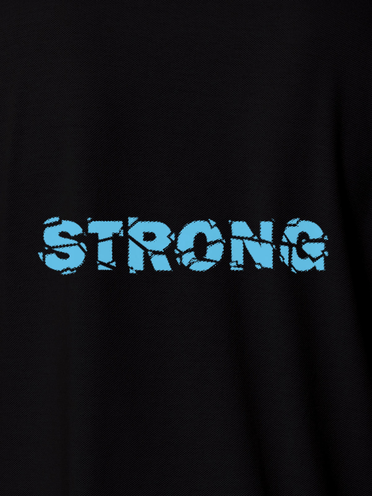 Close up of 'Strong' design on Men's Black Polo T-shirt, highlighting intricate details and vibrant print.