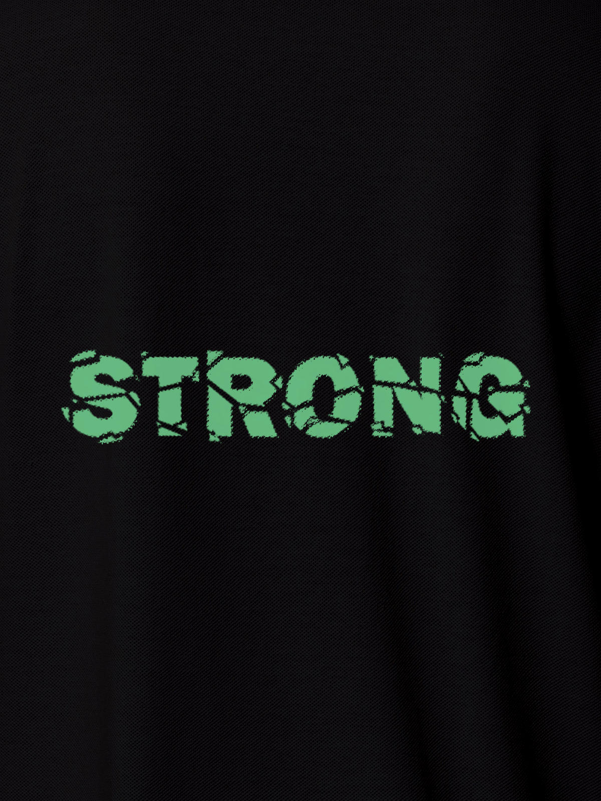 Close up of 'Strong' design on Men's Black Polo T-shirt, highlighting intricate details and vibrant print.