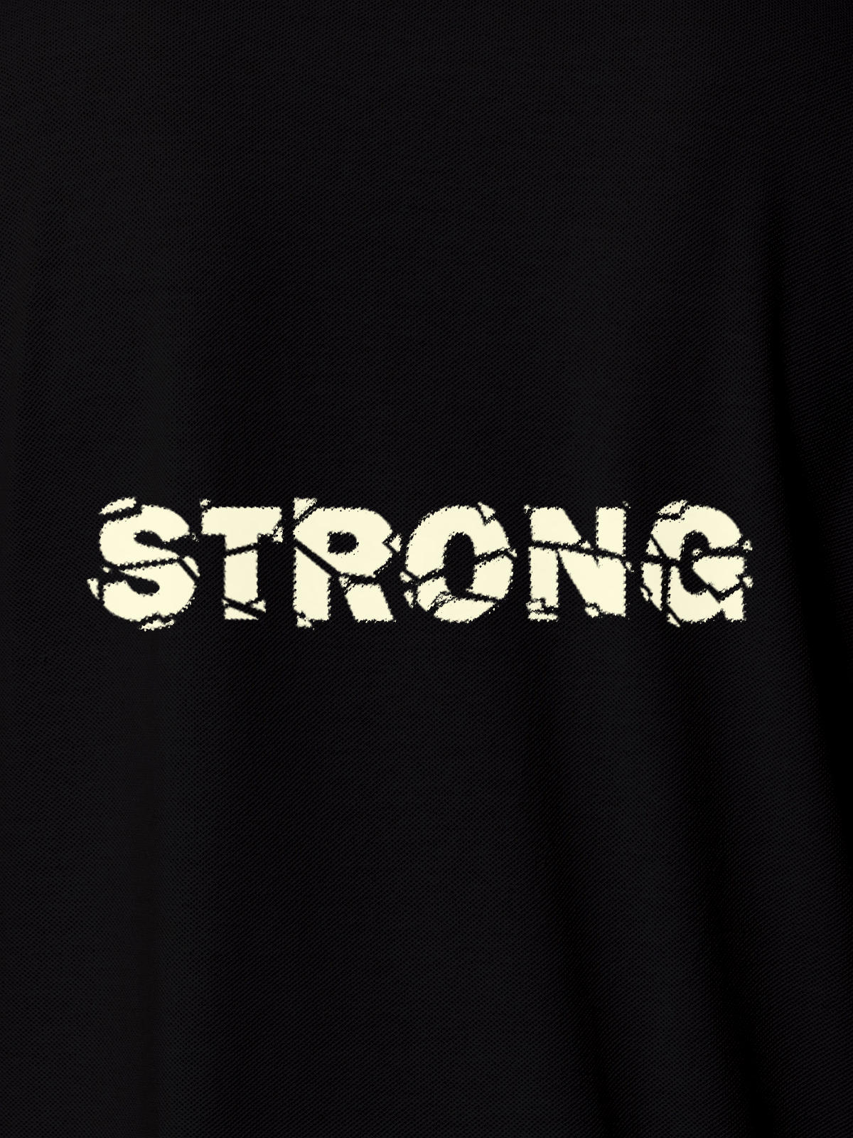 Close up of 'Strong' design on Men's Black Polo T-shirt, highlighting intricate details and vibrant print.