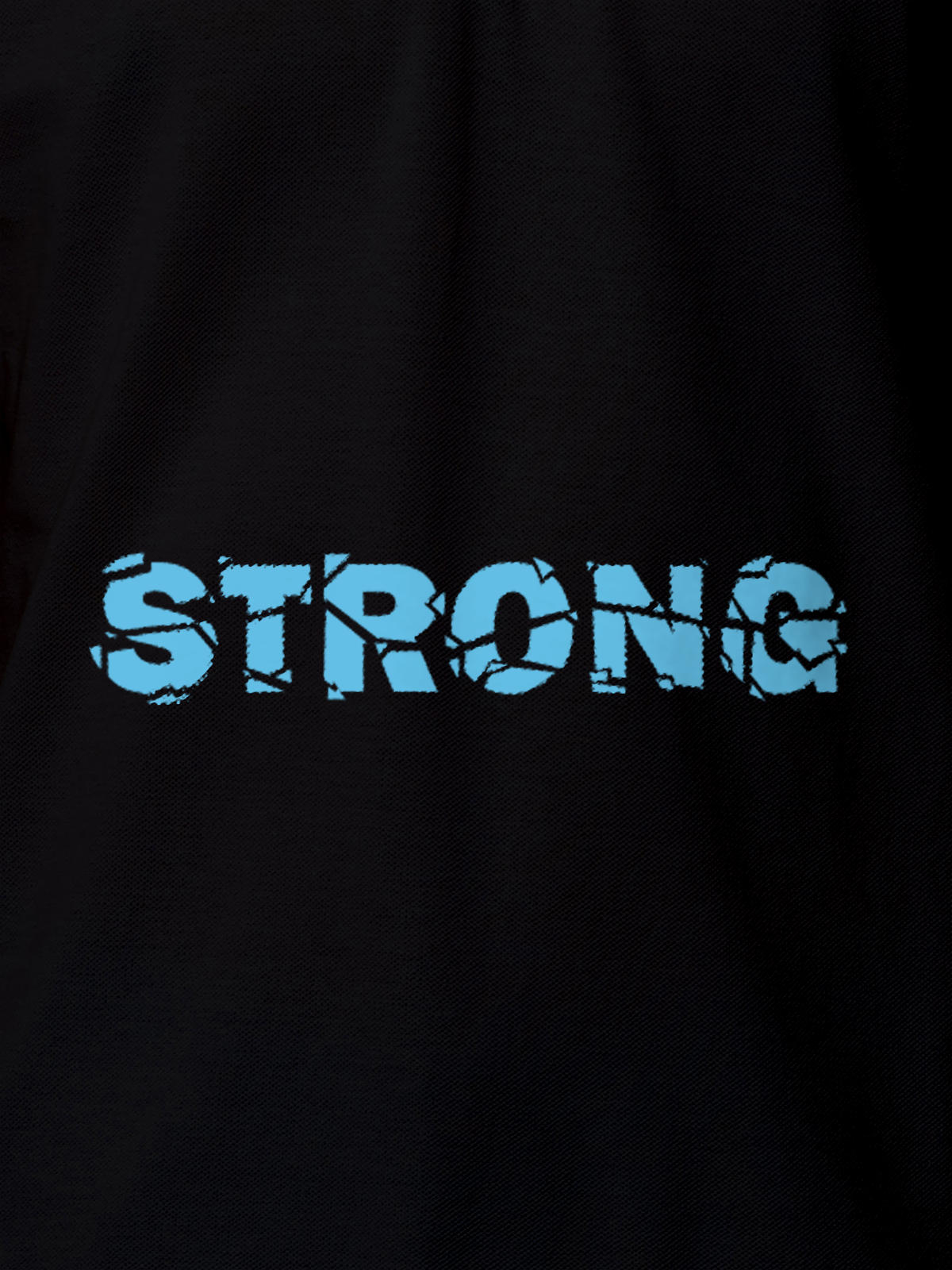 Close up of 'Strong' design on Women's Black Polo T-shirt, highlighting intricate details and vibrant print.