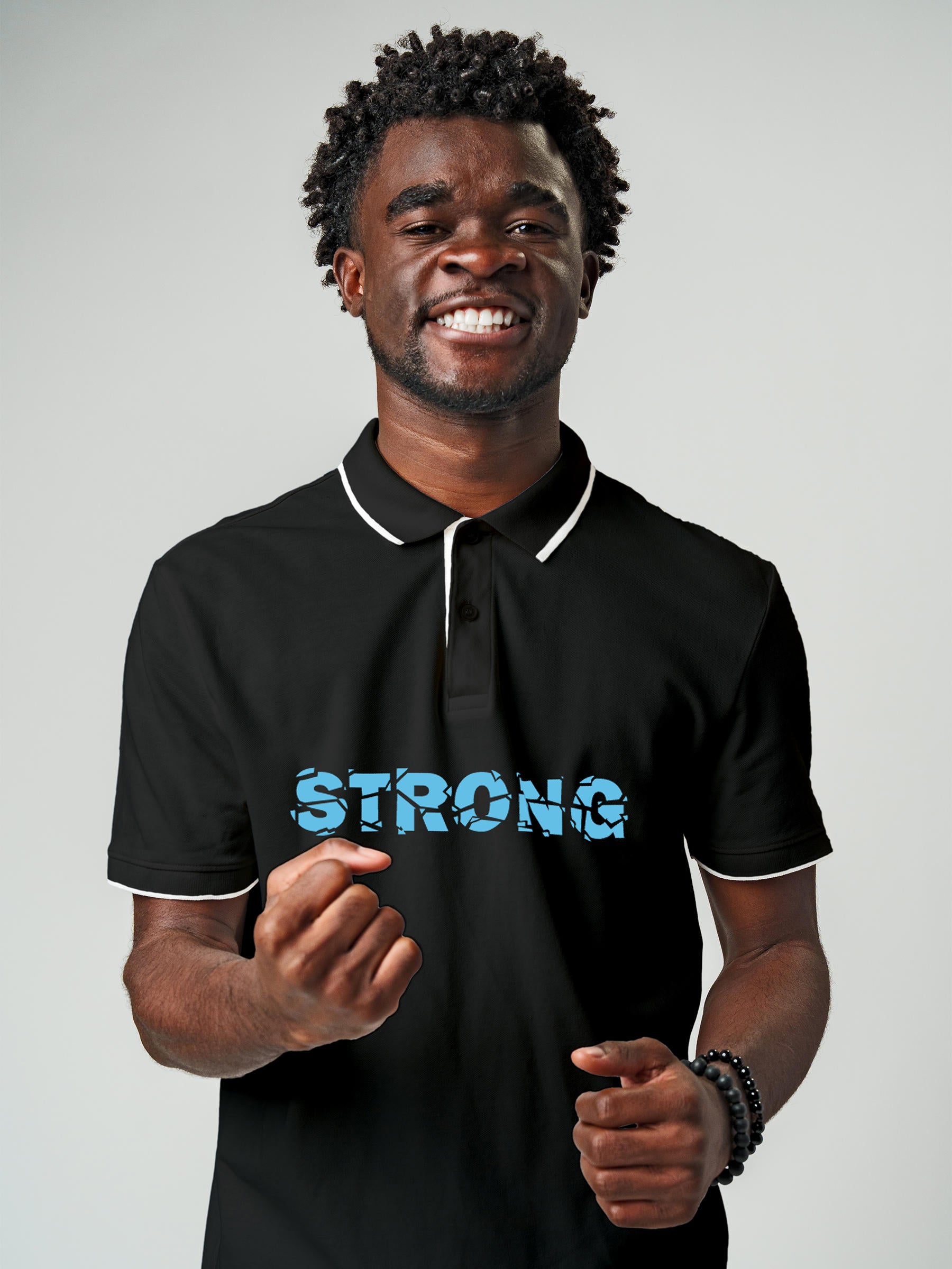 Model wearing Men's Dark Grey Polo T-shirt with 'Strong' design, offering effortless style and premium comfort