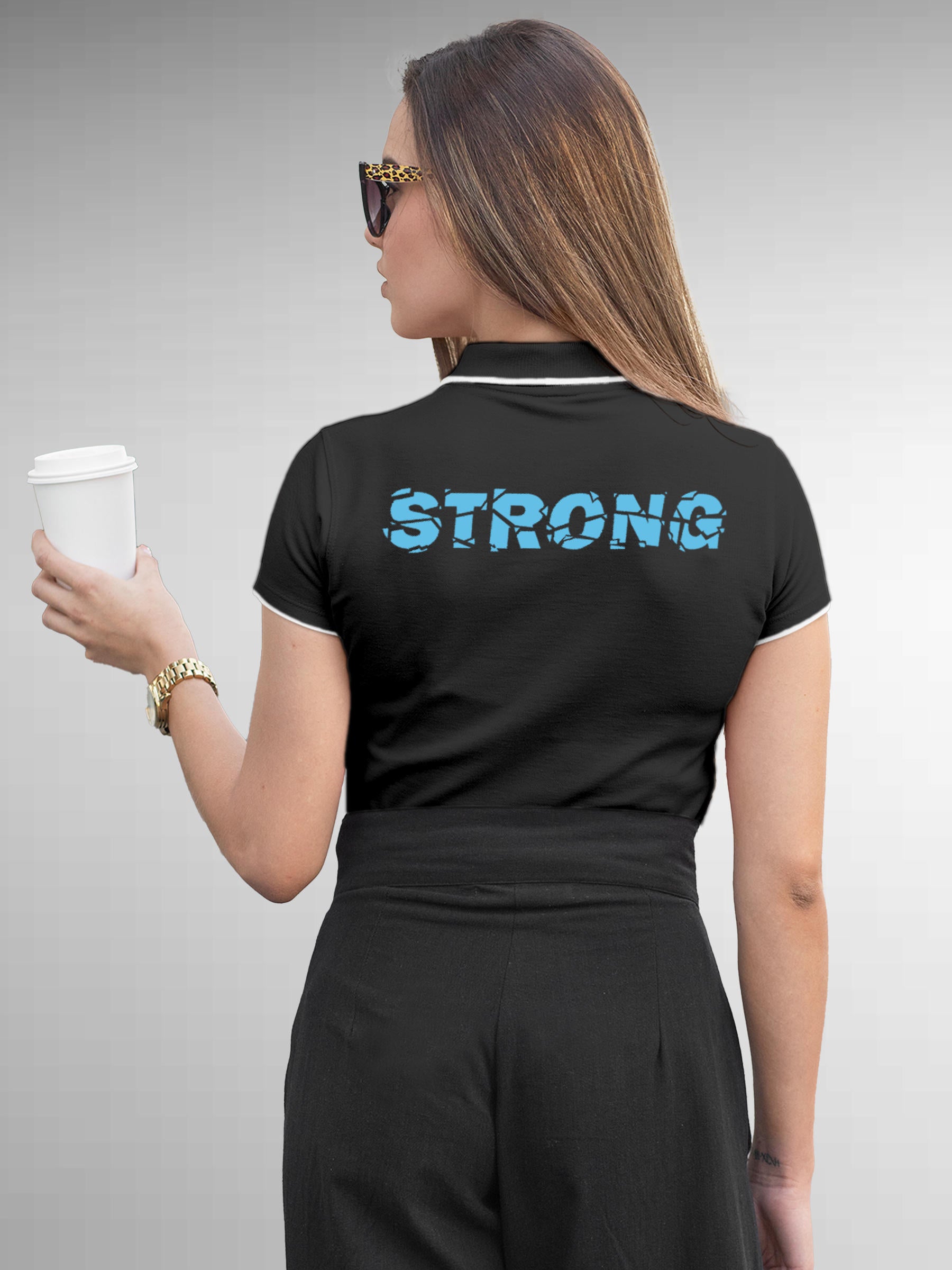 Model wearing Women's Dark Grey Polo T-shirt with 'Strong' design, offering effortless style and premium comfort