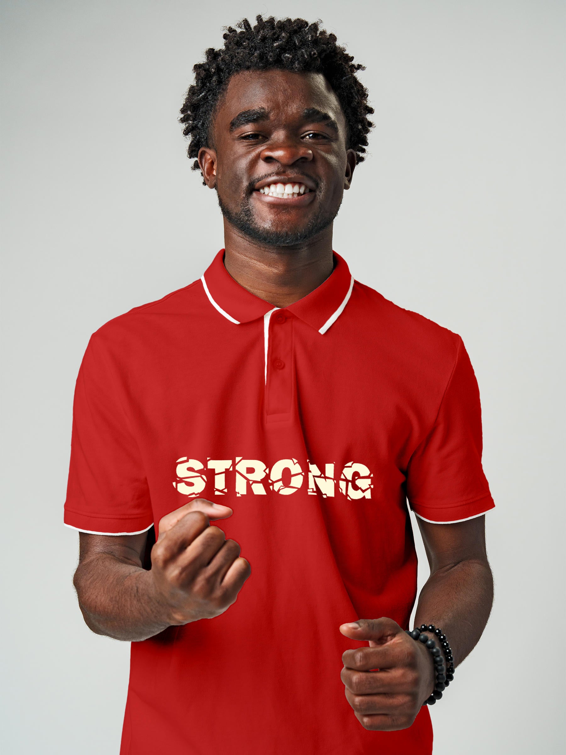 Model wearing Men's Red Polo T-shirt with 'Strong' design, offering effortless style and premium comfort