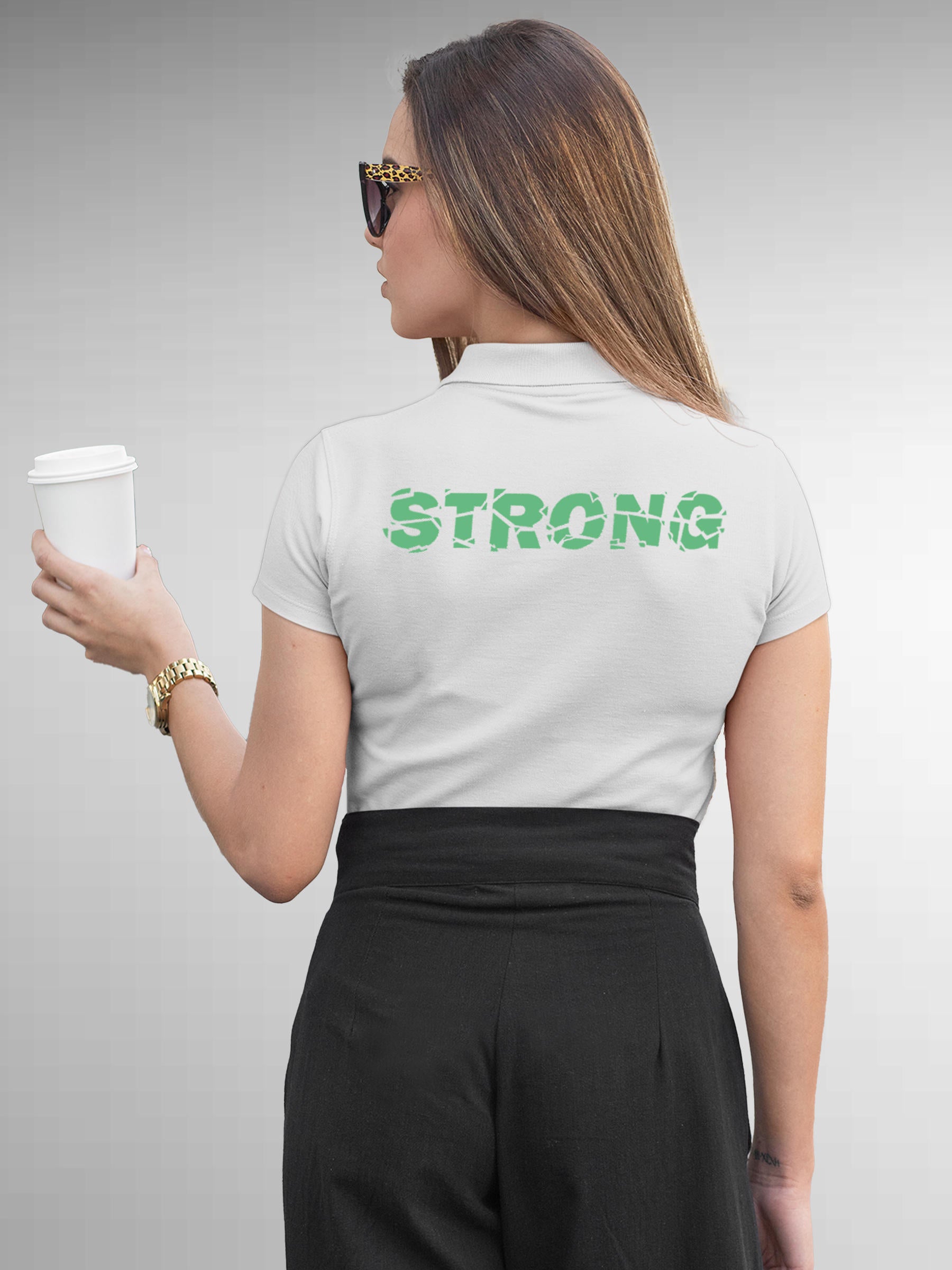 Model wearing Women's White Polo T-shirt with 'Strong' design, offering effortless style and premium comfort