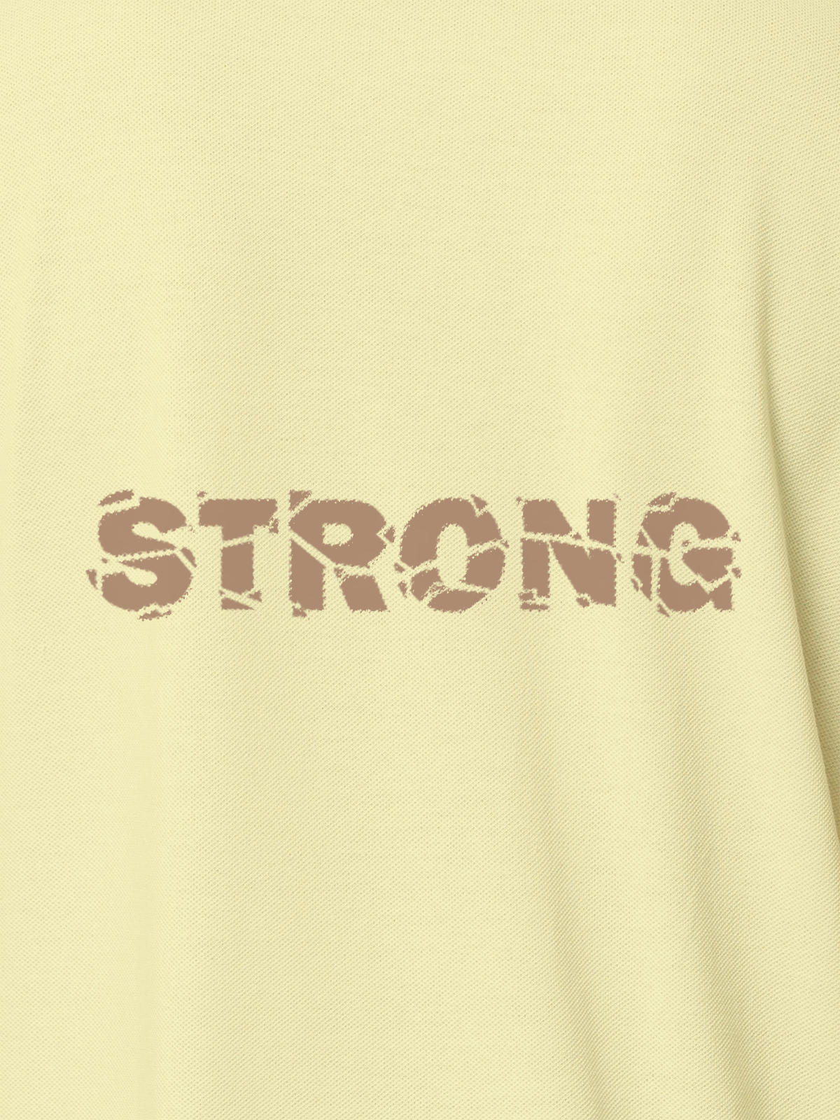 Close up of 'Strong' design on Men's Yellow Polo T-shirt, highlighting intricate details and vibrant print.