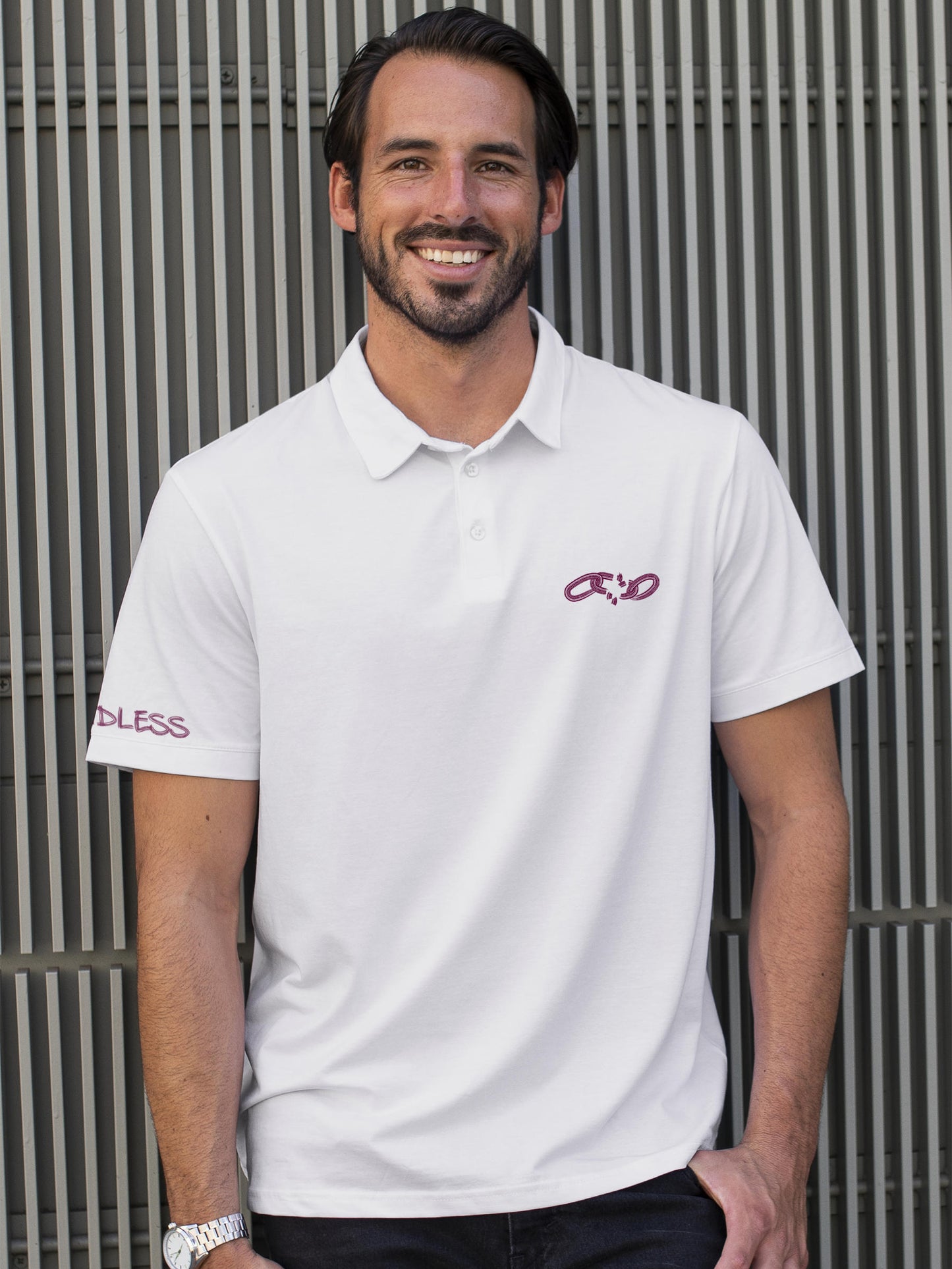 Model wearing Men's White Polo T-shirt with 'Boundless' design, offering effortless style and premium comfort