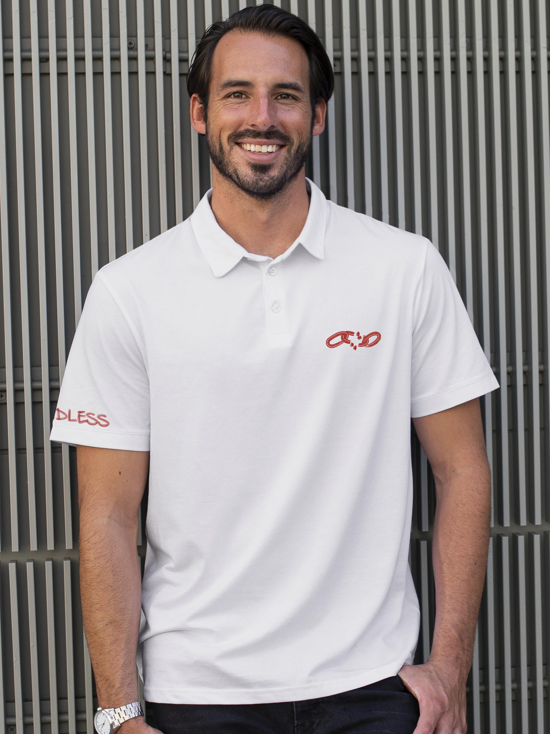 Model wearing Men's White Polo T-shirt with 'Boundless' design, offering effortless style and premium comfort