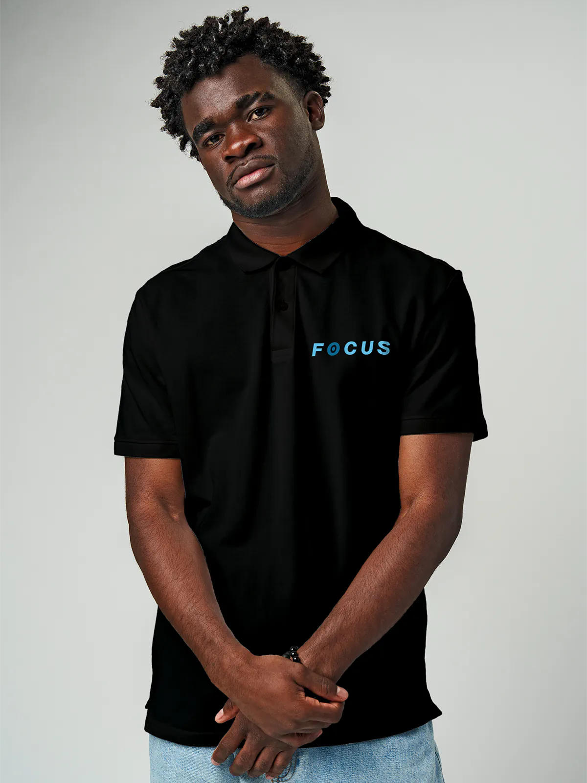 Close up of 'Focus' design on Men's Black Collar T-shirt, highlighting intricate details and vibrant print.