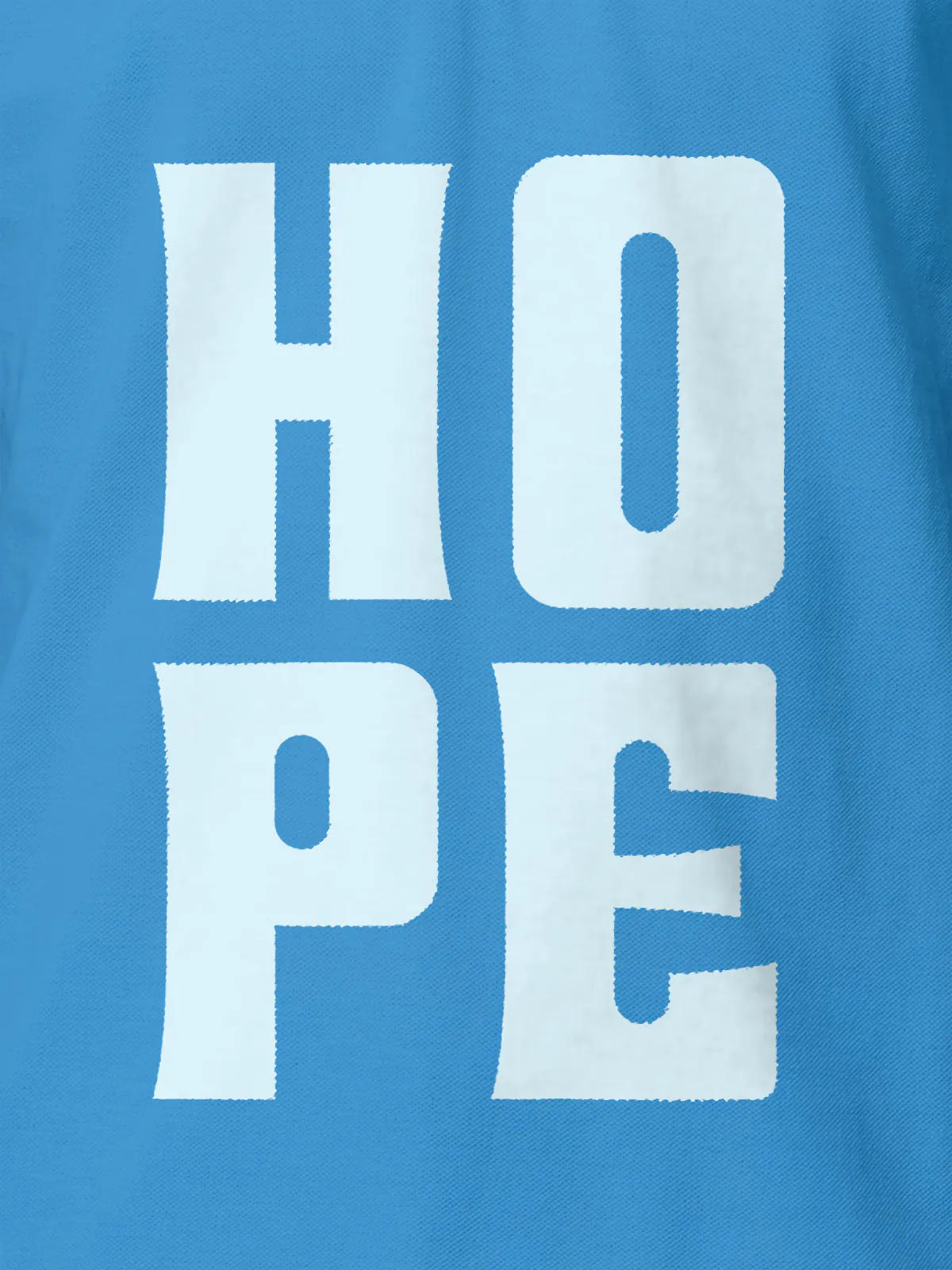 Close up of 'Hope' design on Women's Blue Polo T-shirt, highlighting intricate details and vibrant print.